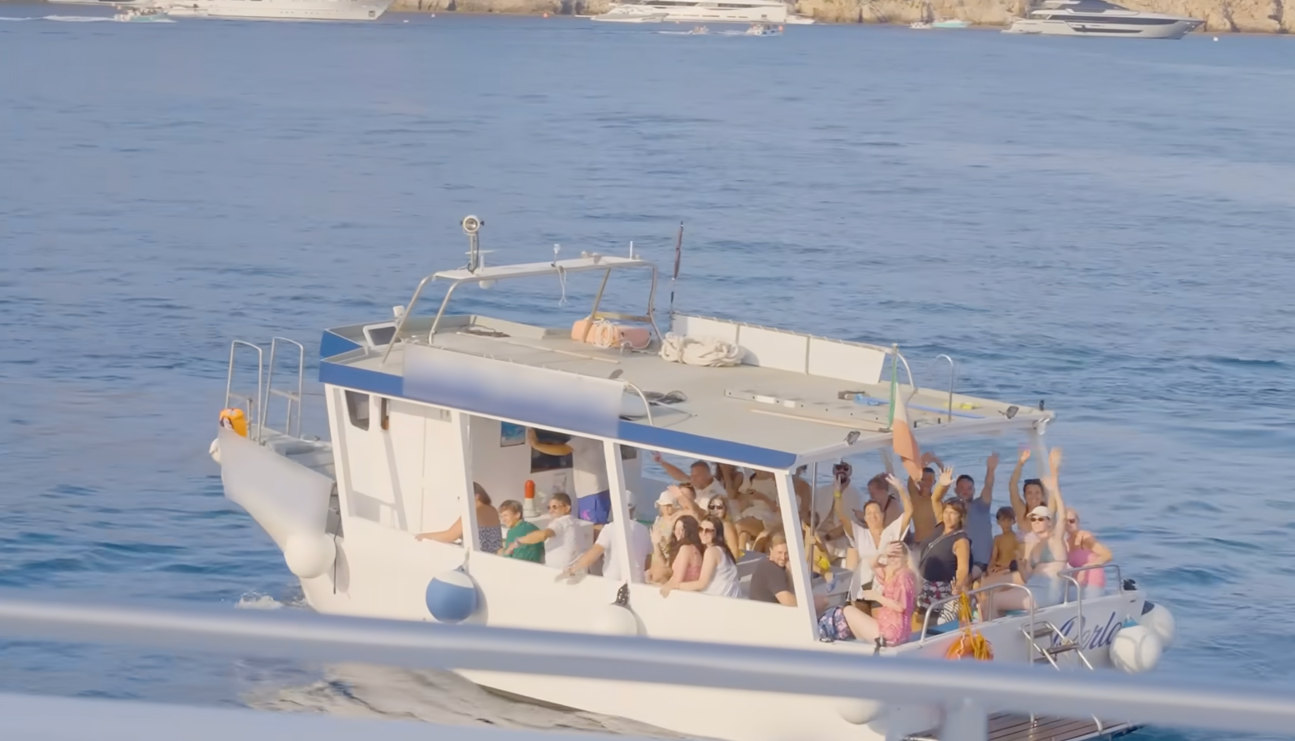 Boats filled with tourists hoping to get a glimpse of Haaland are sailing past his yacht