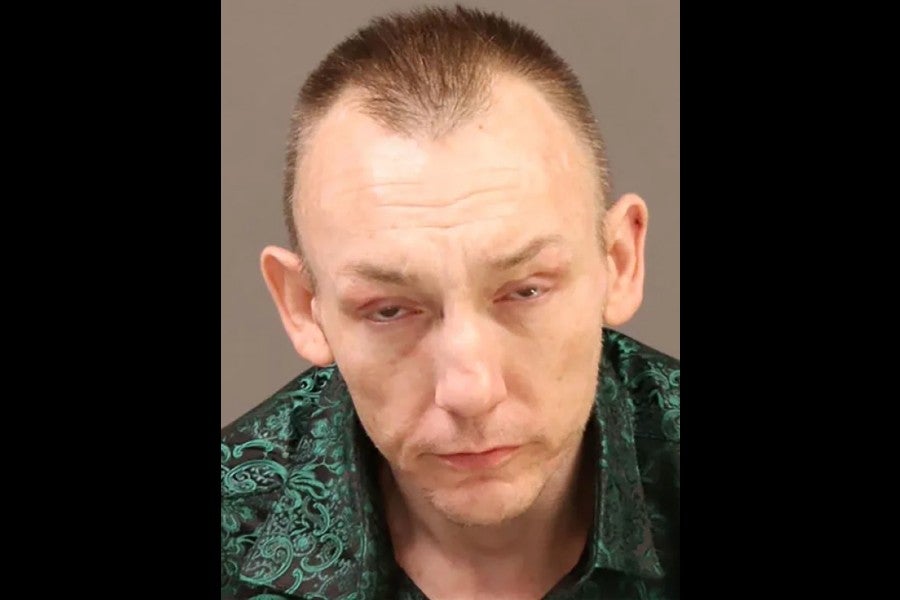 Eugene Horsch, 44, remains in federal custody facing weapons and fraudulent credential charges, while police pore over evidence seized from the home he shared with his late father