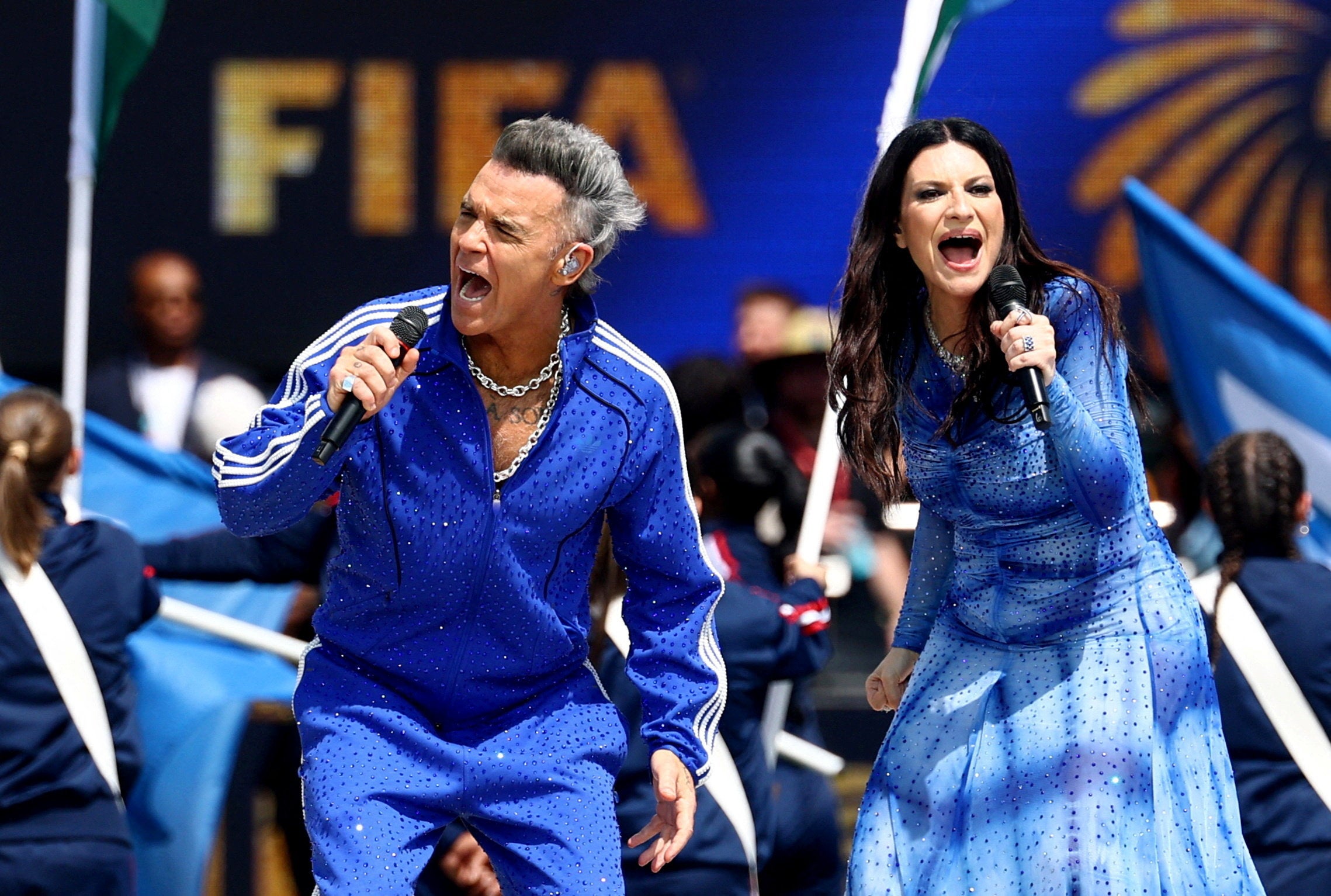 Williams, seen with Italian singer Laura Pausini, recently performed at the World Cup closing ceremony