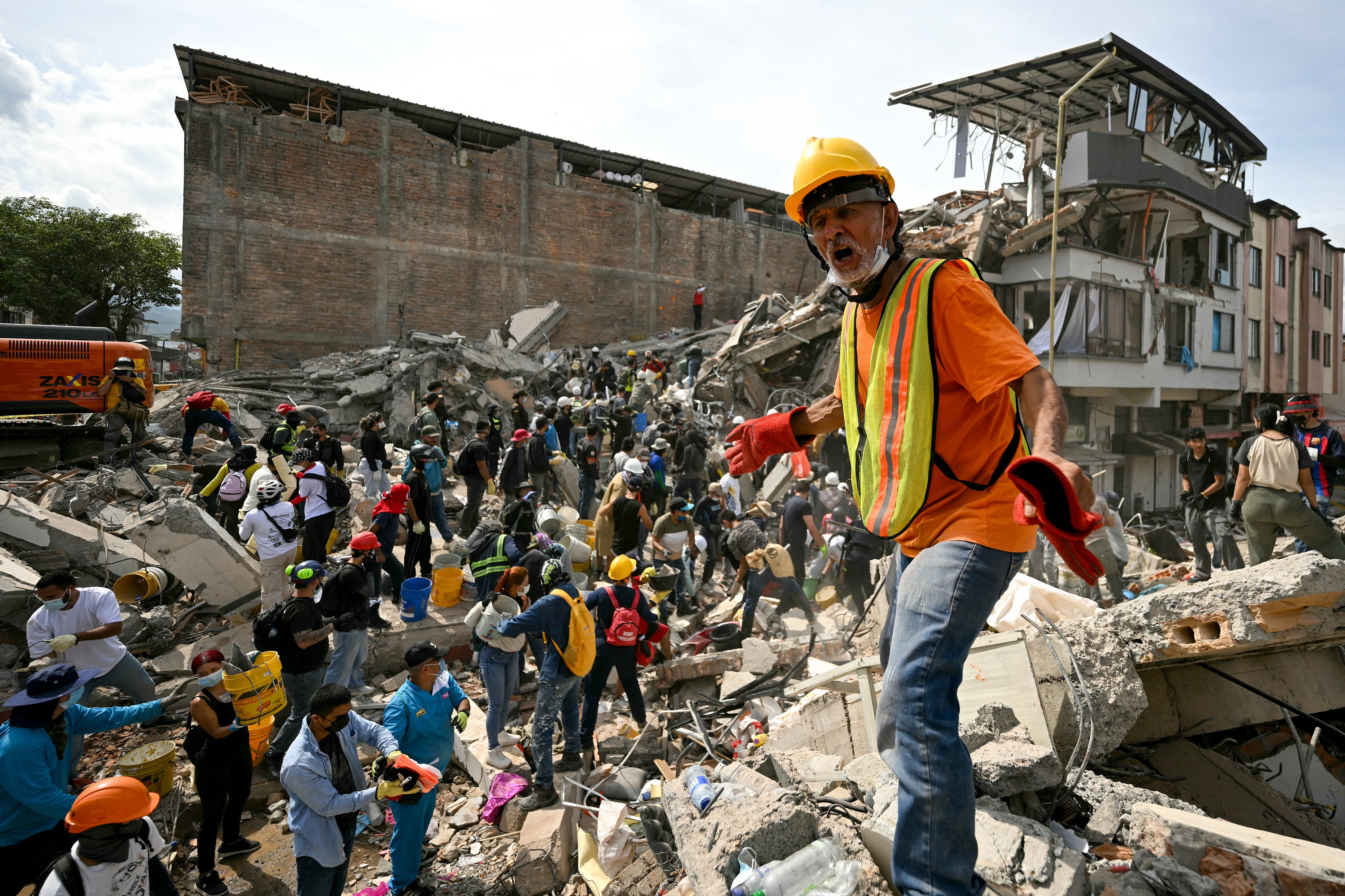 <p>Rescuers search for survivors amid the rubble of a collapsed building after an earthquake in Pereira, Colombia, earlier this month. Multiple major earthquakes have caused havoc around the globe this summer</p>