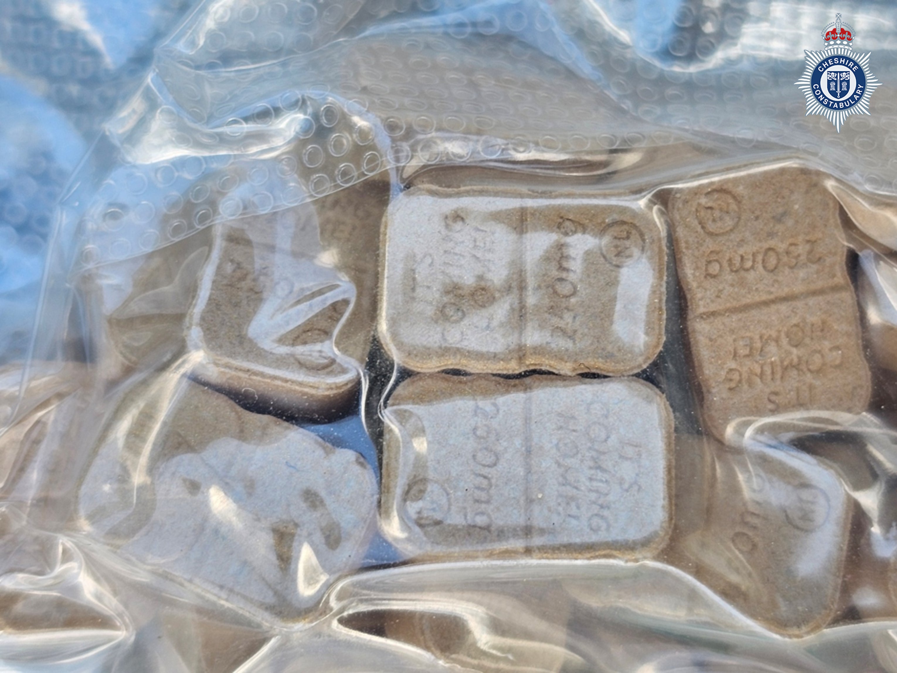 A tablet marked ‘It’s Coming Home’, which was among a large quantity of Class A, B and C drugs found by police buried in the grounds of the Creamfields 2026 festival