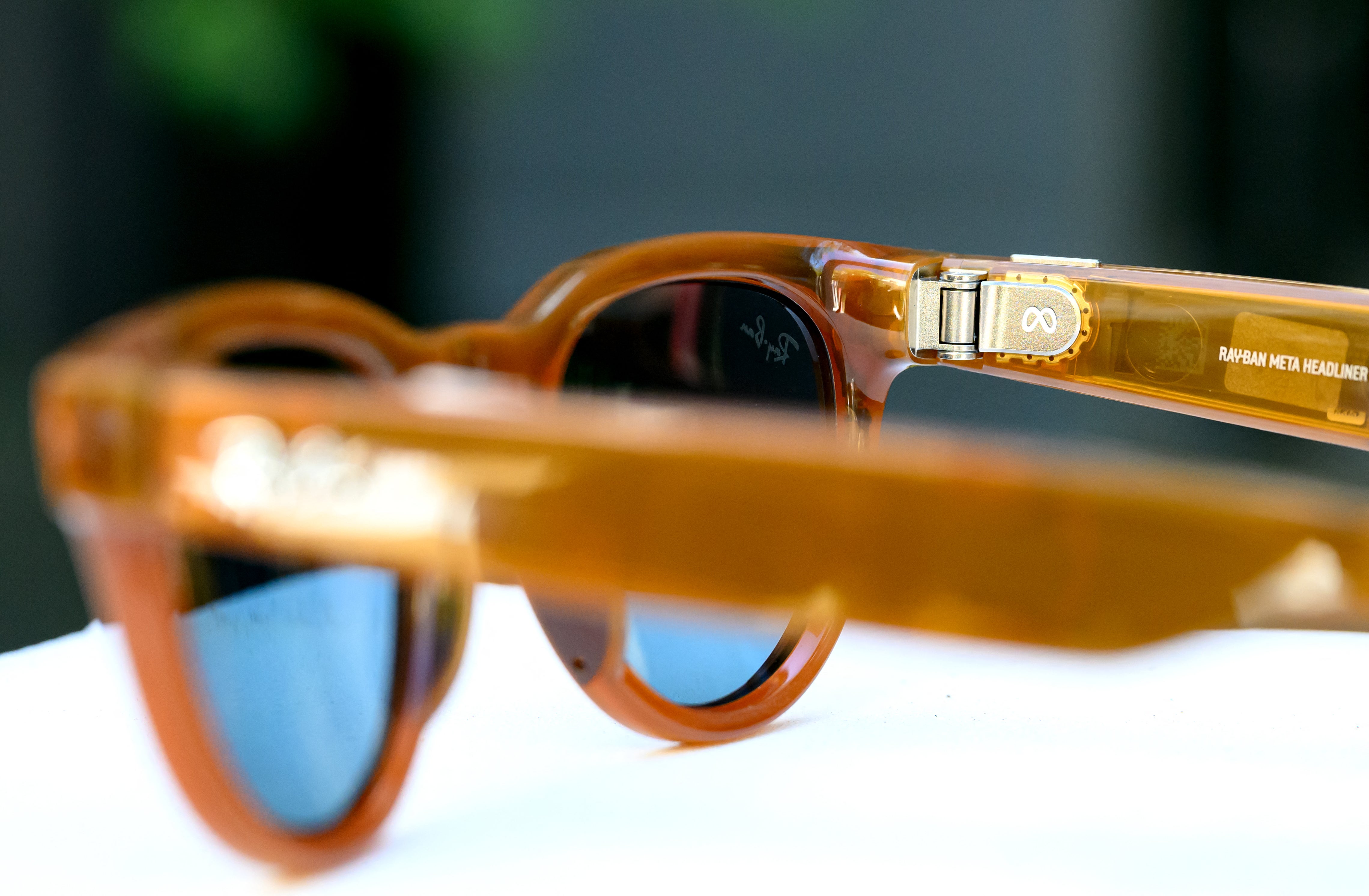Close-up of Meta smart glasses, possibly with a faint glowing light indicating recording, symbolizing a privacy feature