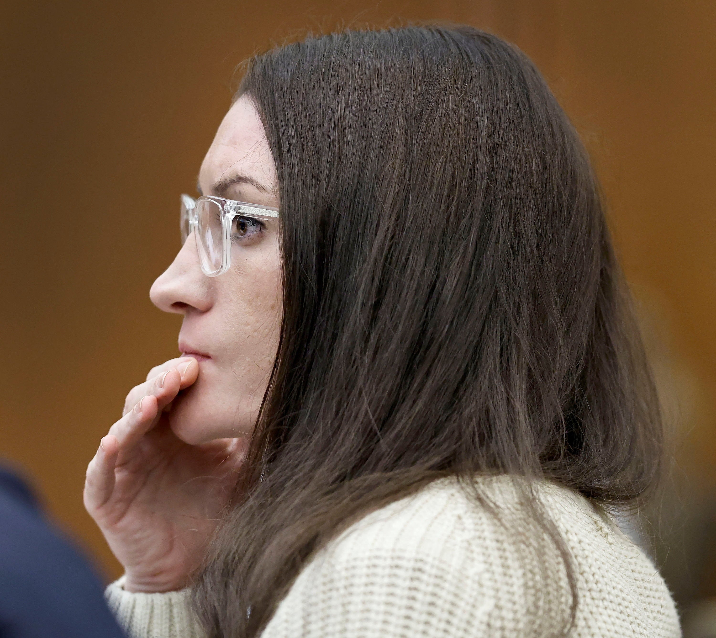 Clancy listens to forensic psychologist Dr. Kirk Heilbrun testify about the voices she says she heard before she strangled her three children