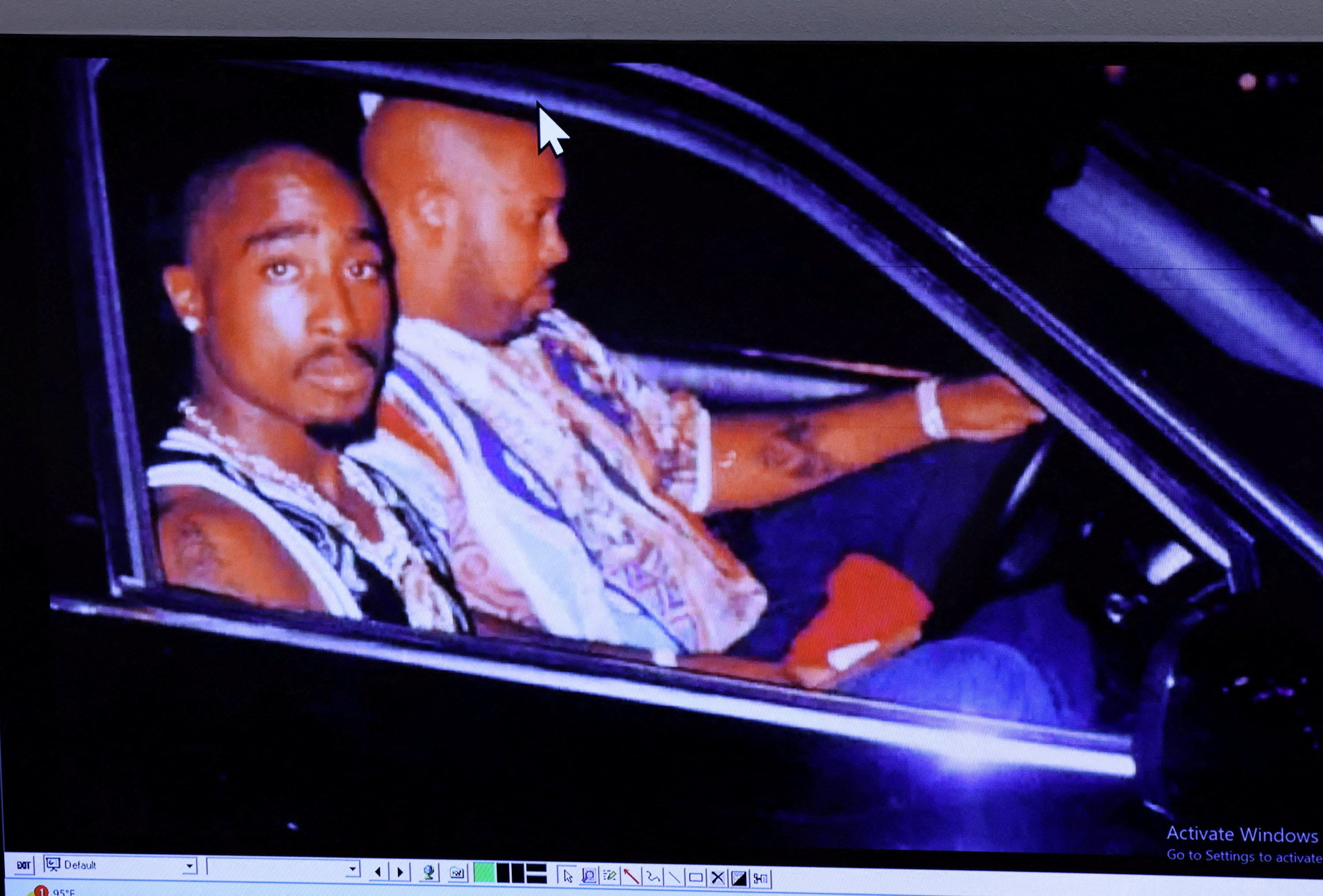 Tupac, pictured here moments before his death, was shot four times in Nevada