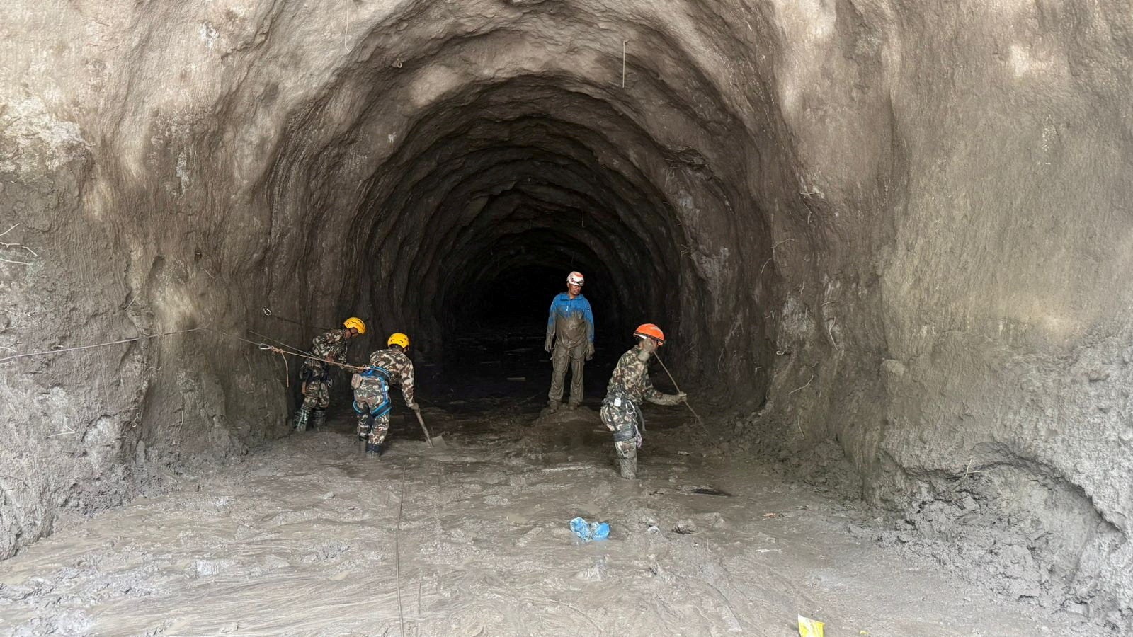 Nepal flood rescuers race to find hundreds of workers trapped in tunnels