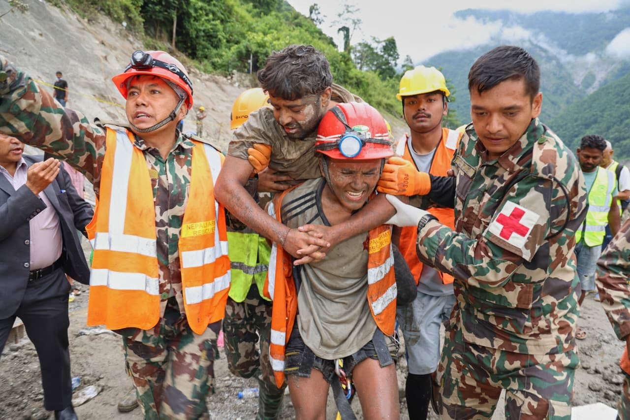Two men rescued after faint voices heard coming from hydropower tunnel nine days after Nepal floods