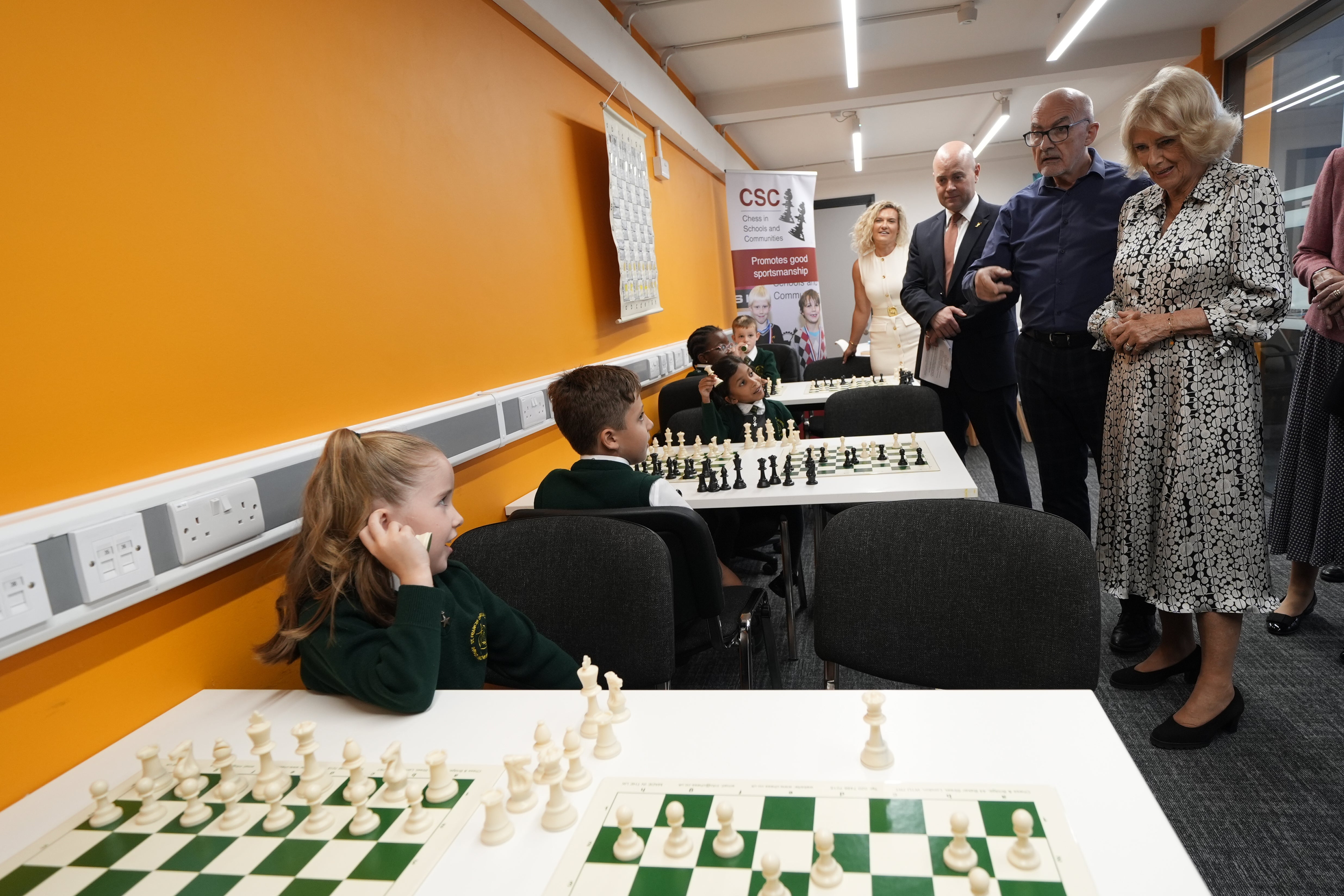 Camilla watches local schoolchildren play chess during a visit to Liverpool (Peter Byrne/PA)