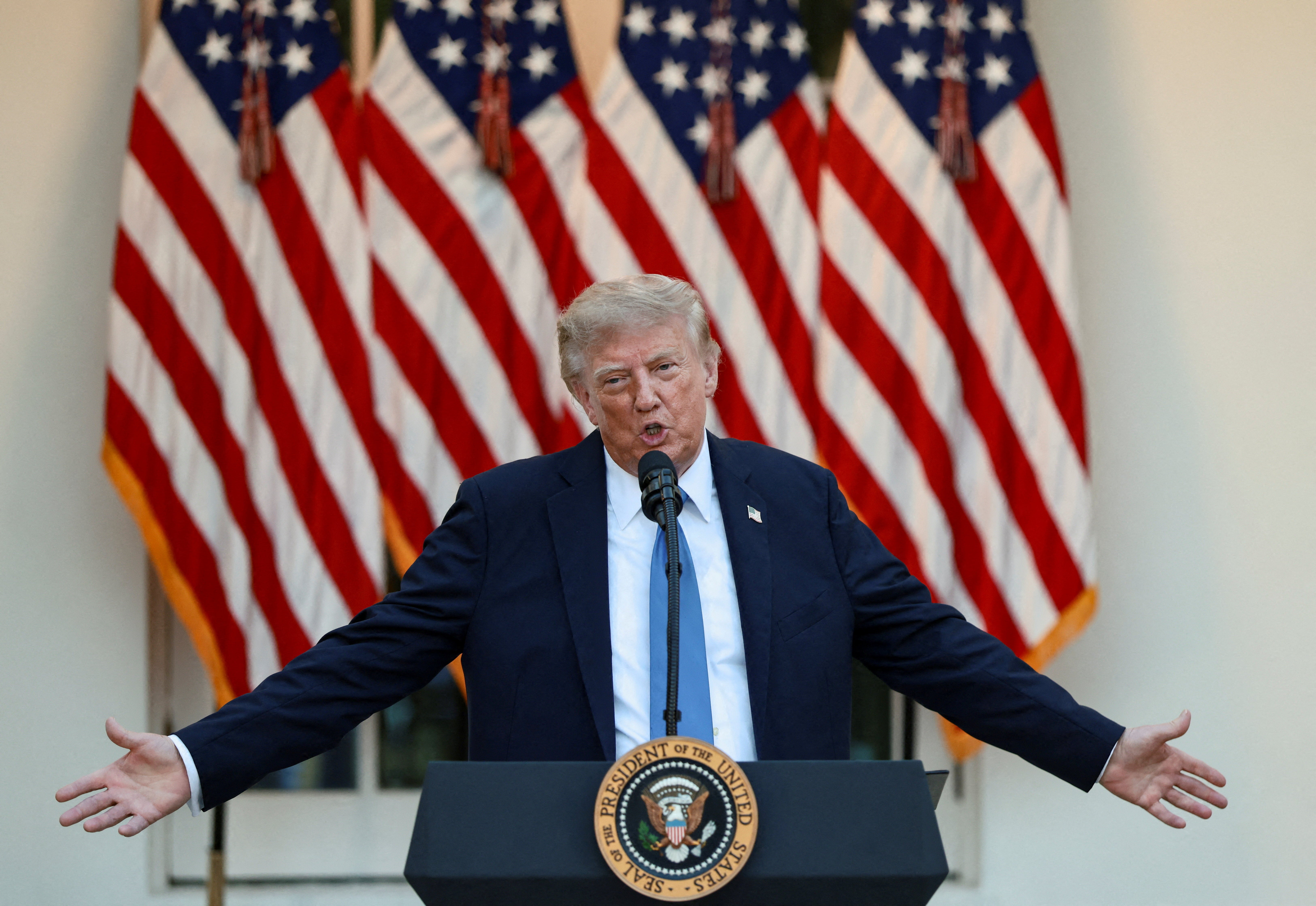 President Donald Trump speaks while hosting a dinner in the Rose Garden at the White House (Reuters)