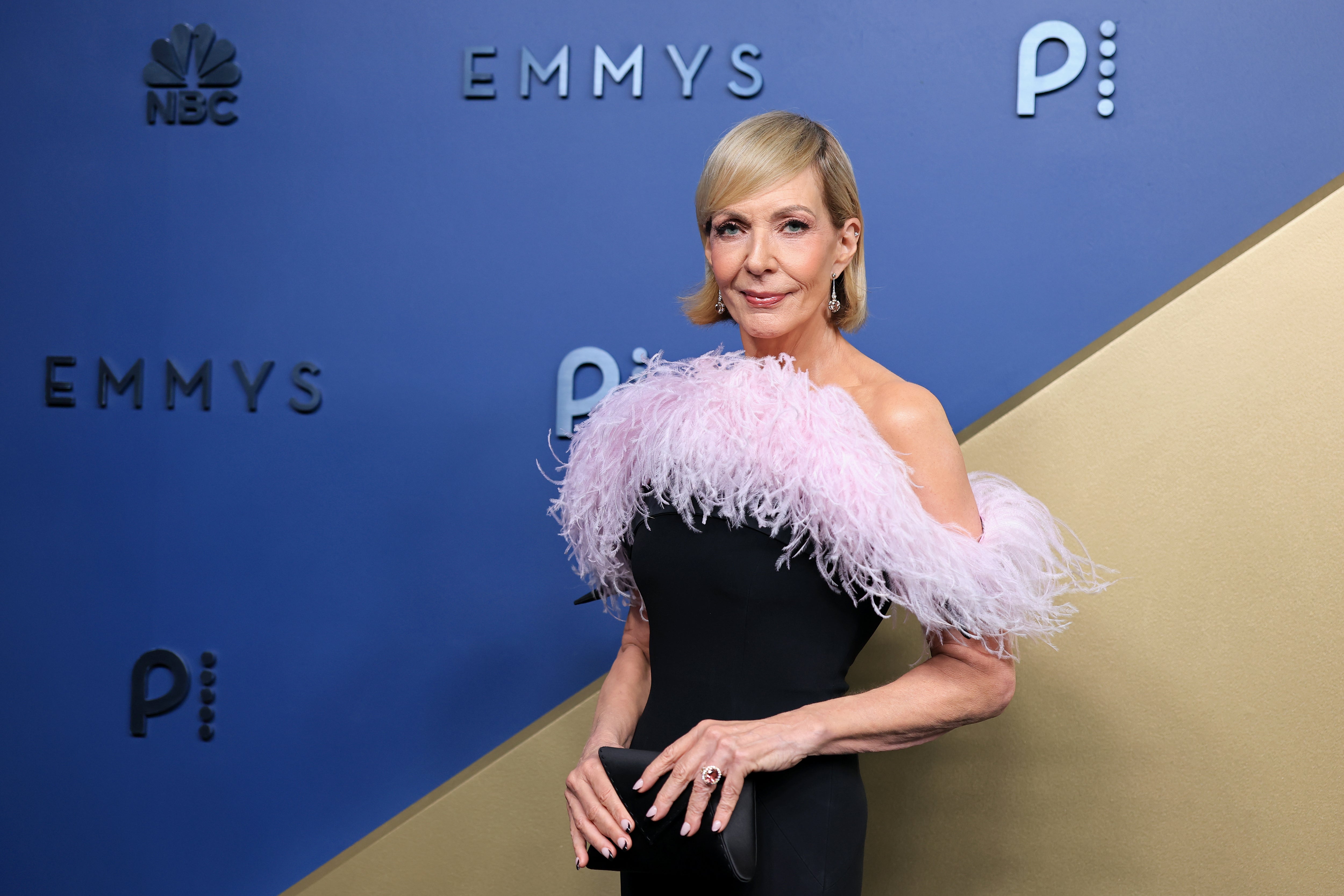 'The Diplomat' star's feathered neckline elevated the plain black frock in the best way