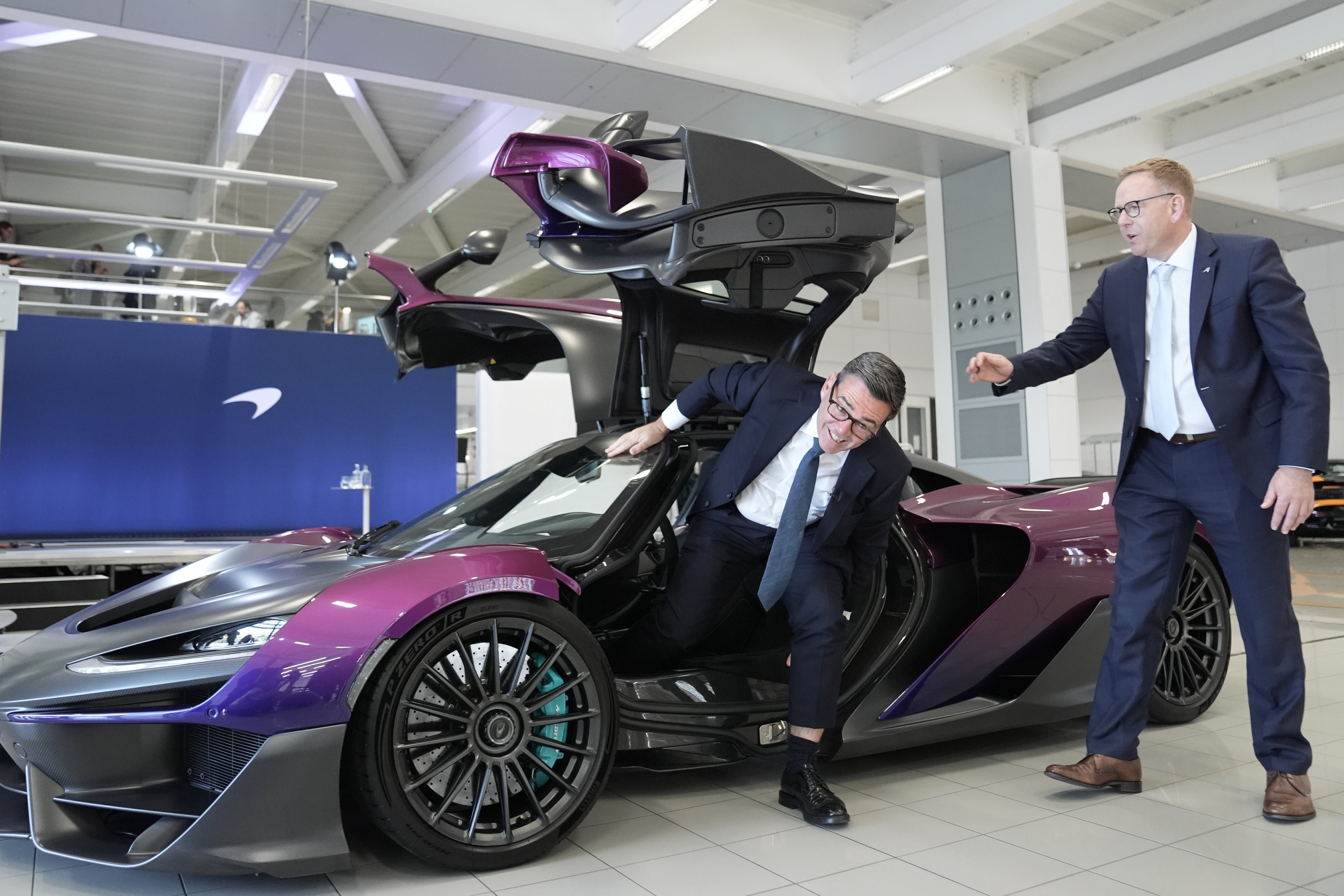 Mr Burnham sat inside a McLaren W1 supercar (Stefan Rousseau/PA)
