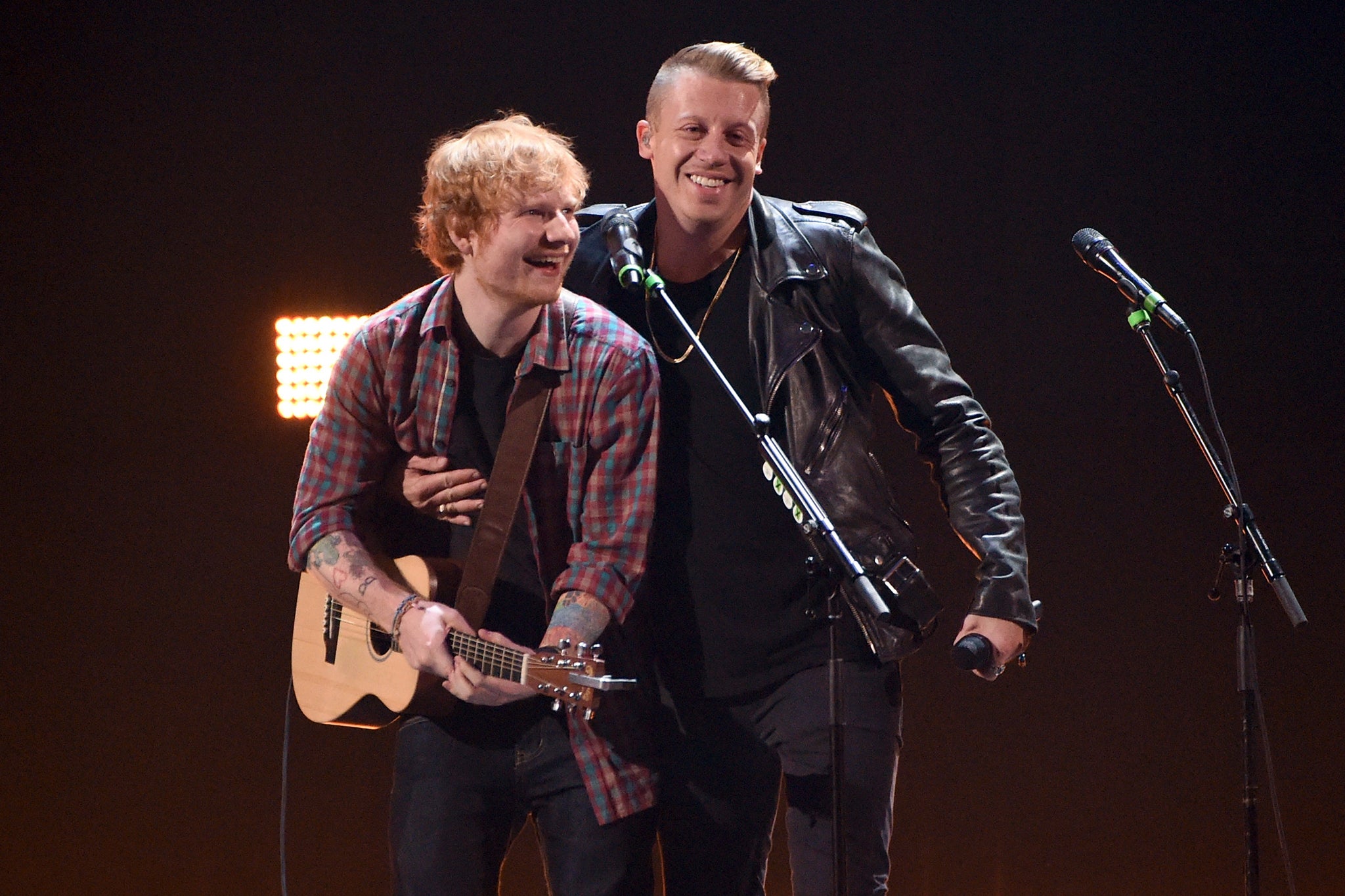 Singer/songwriter Ed Sheeran (L) and rapper Macklemore perform onstage during the 2014 iHeartRadio Music Festival at the MGM Grand Garden Arena in 2014