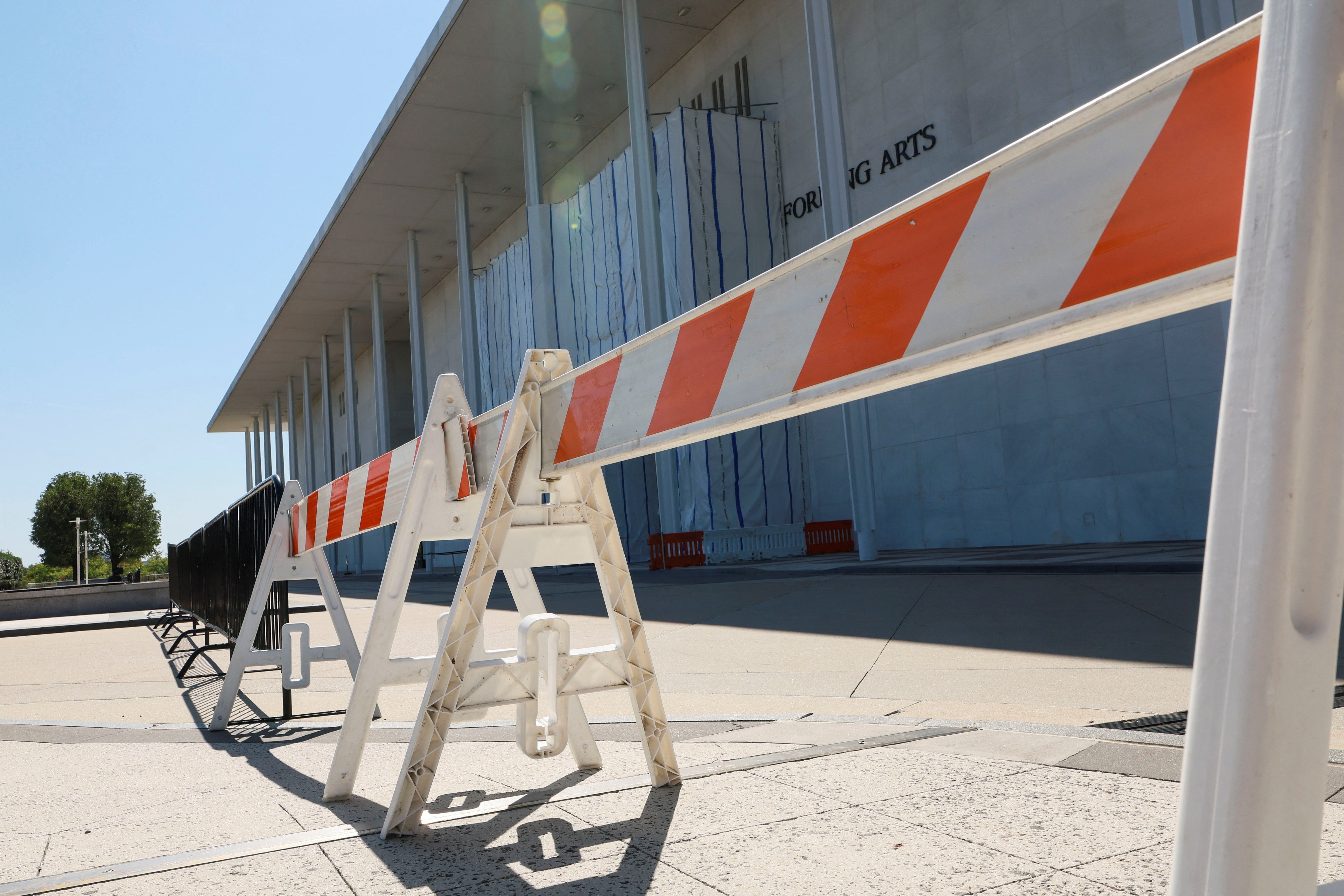 Workers installed fencing and barricades around the Kennedy Center on September 16 after the board voted to shutter the institution