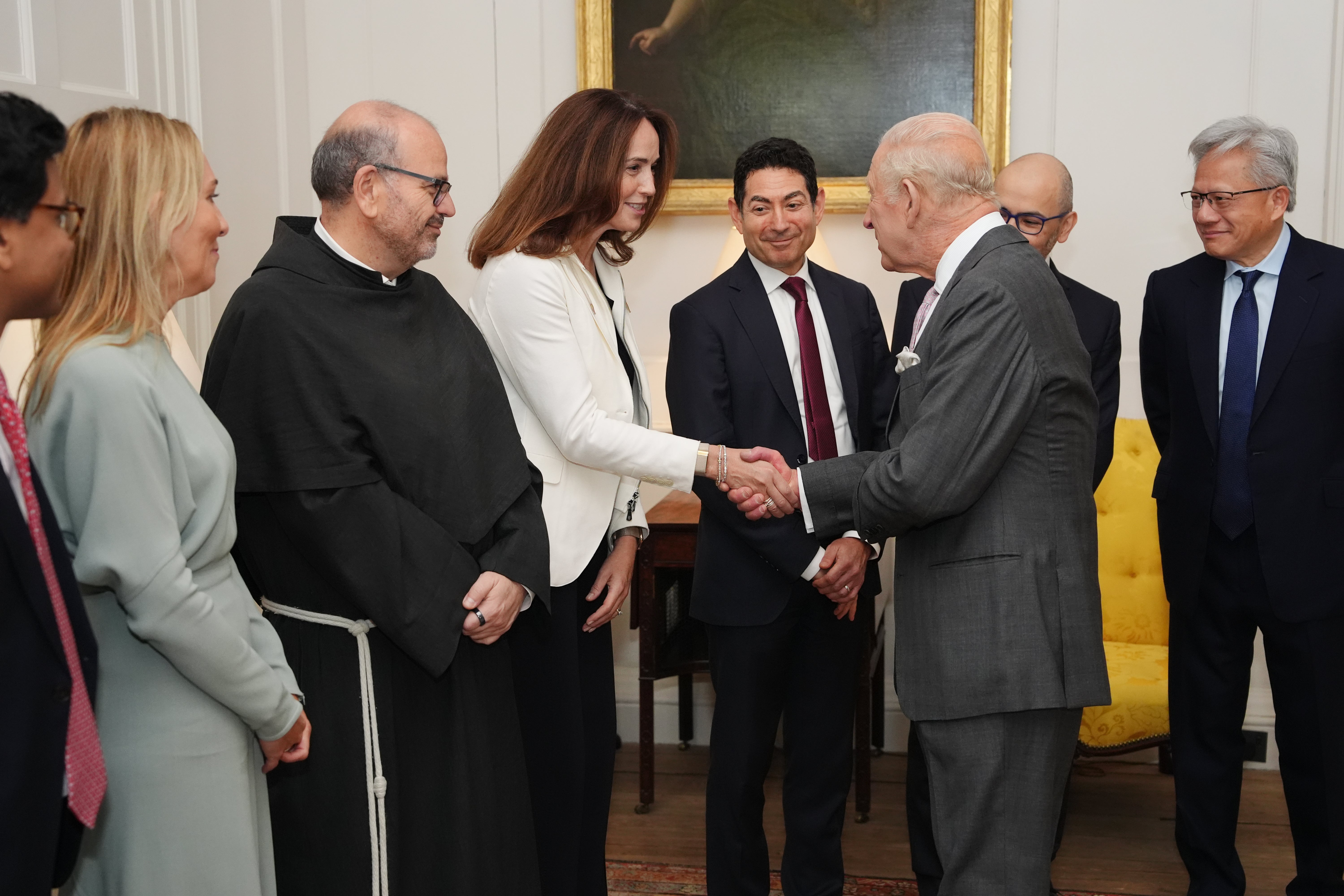 King Charles III shakes hands with chief financial officer of OpenAI Sarah Friar during a meeting for leaders from the artificial intelligence (AI) sector