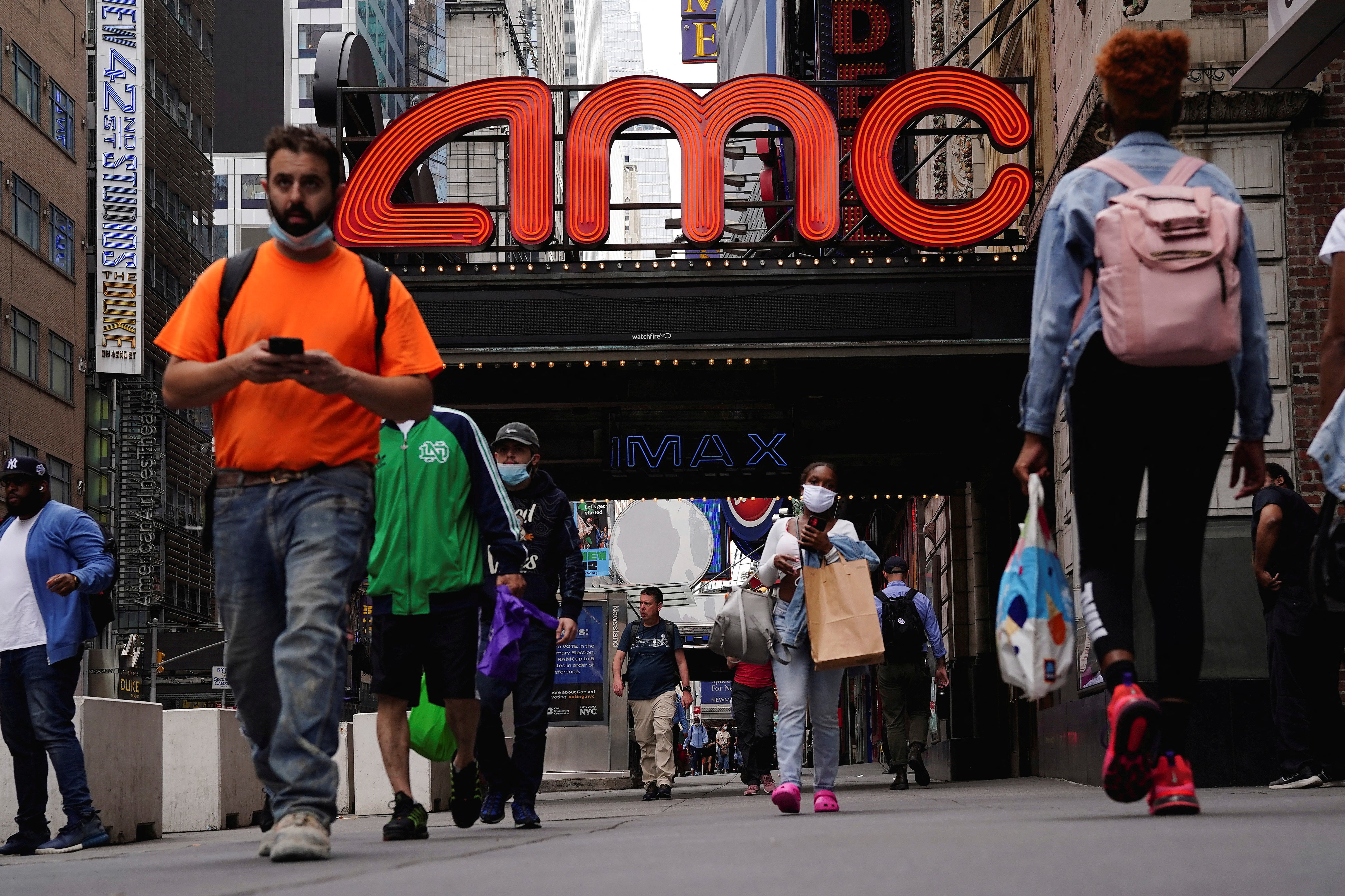 A man was arrested after allegedly pepper-spraying a movie goer who was using his cellphone during the film
