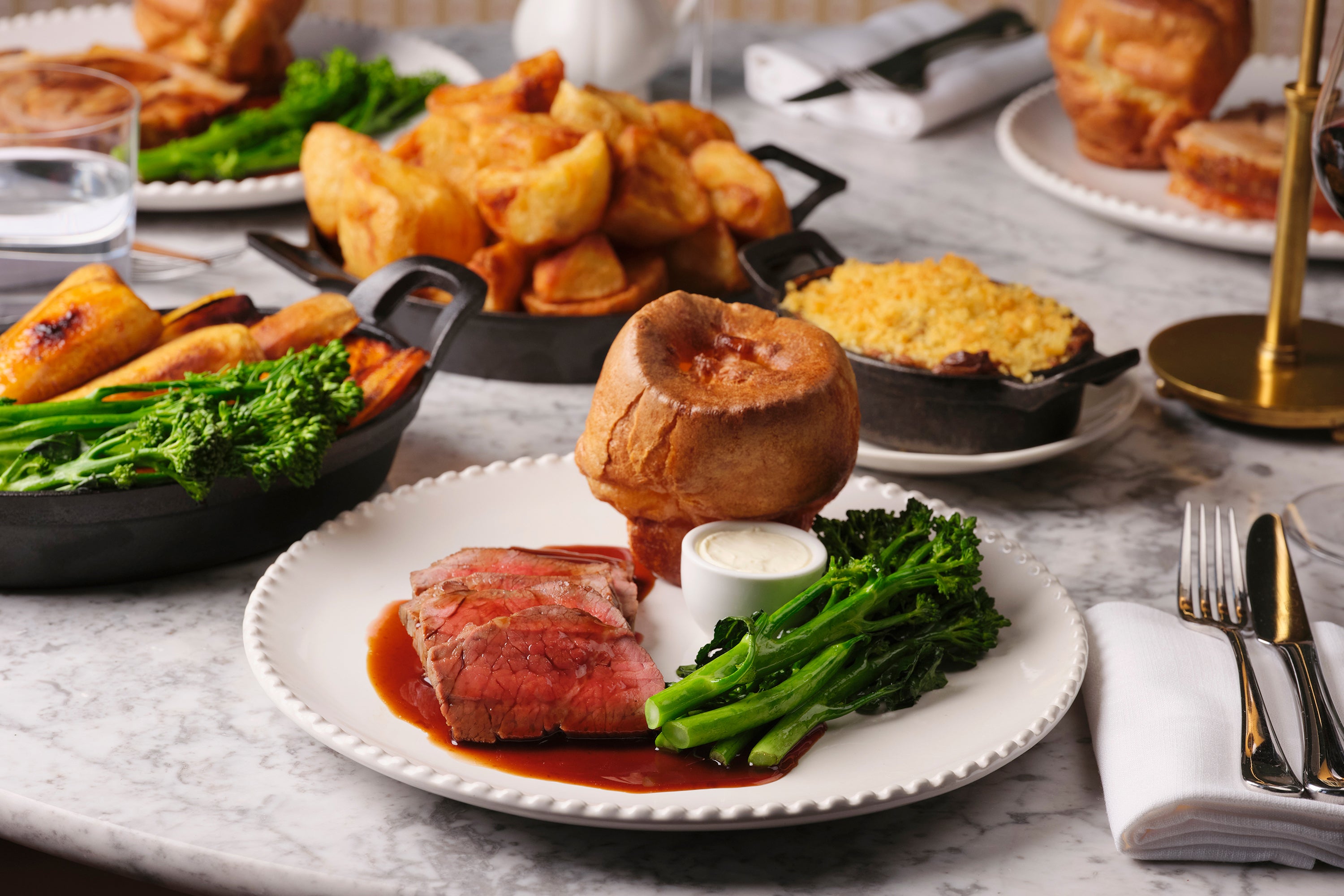 Abé keeps the bones of the Sunday roast intact – crisp potatoes, Yorkshire pudding and proper gravy – but makes a case for ketchup with her roasted tomato version