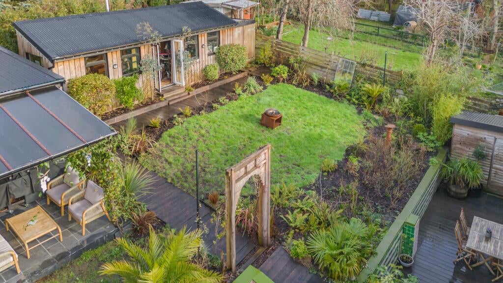 The property has a backyard den and a music studio
