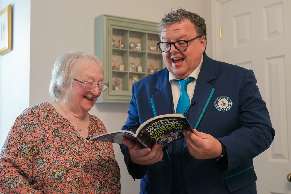 Cath Bowie, pictured reading a draft of the Guinness Book wgrg