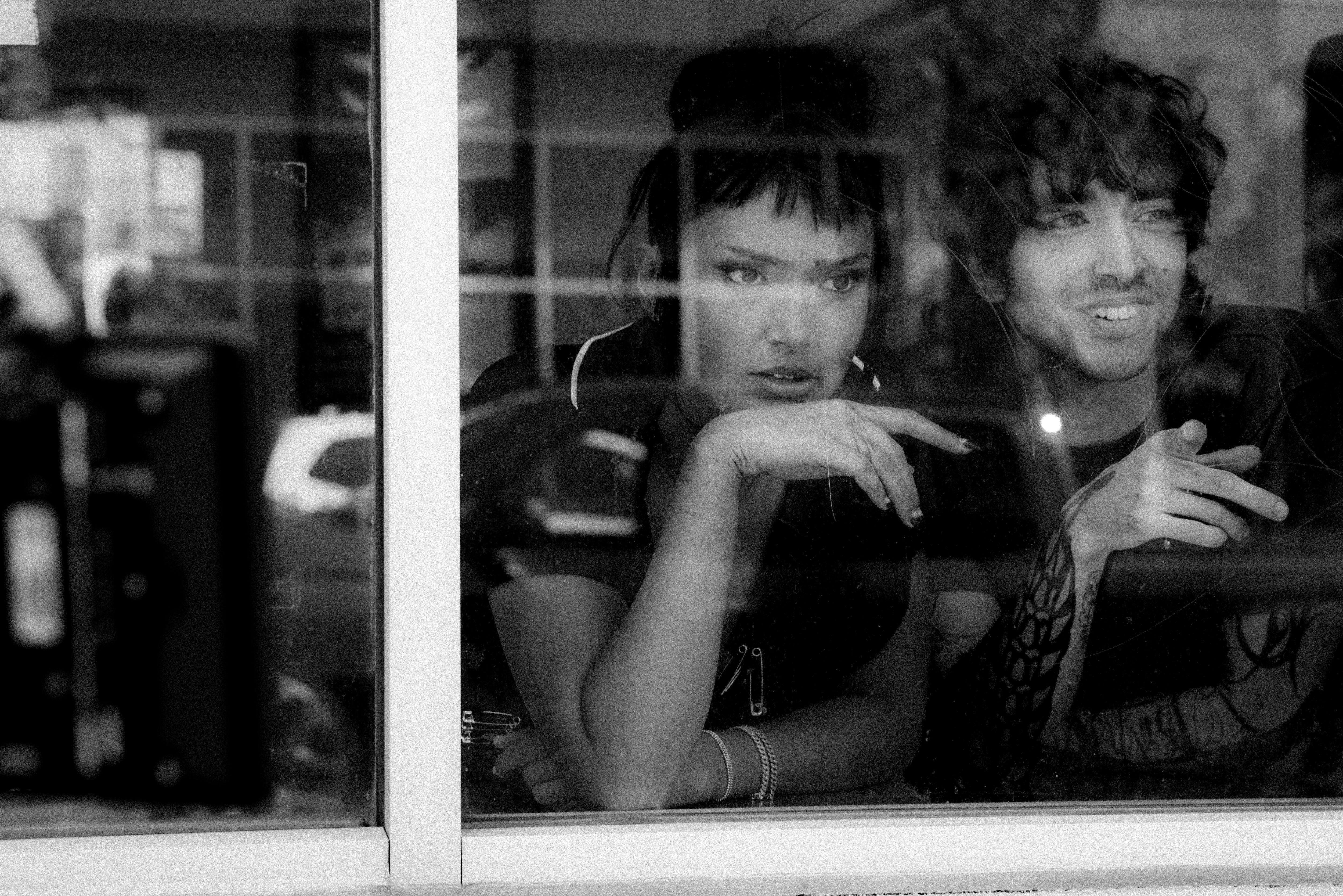 Crookes with co-star Matt Whipps in the music video for ‘Painkiller’