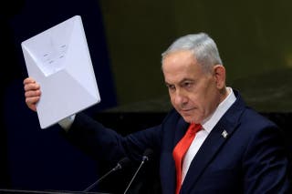 Israeli prime minister Benjamin Netanyahu holds up a Starlink device as he addresses the 81st United Nations General Assembly