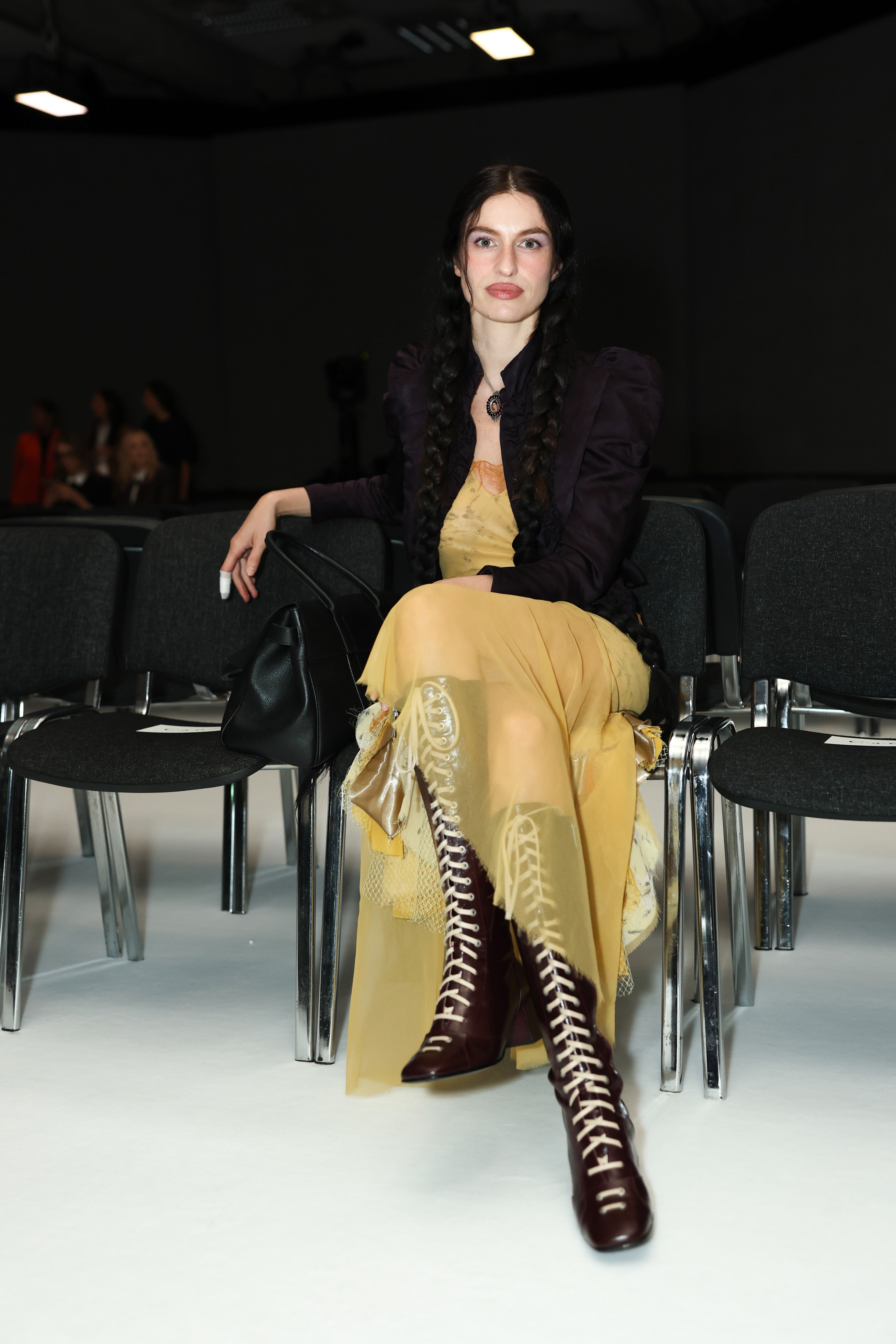 Tali Lennox in a pair of Lili Curia boots on the front row at Christopher Kane for Mulberry at LFW