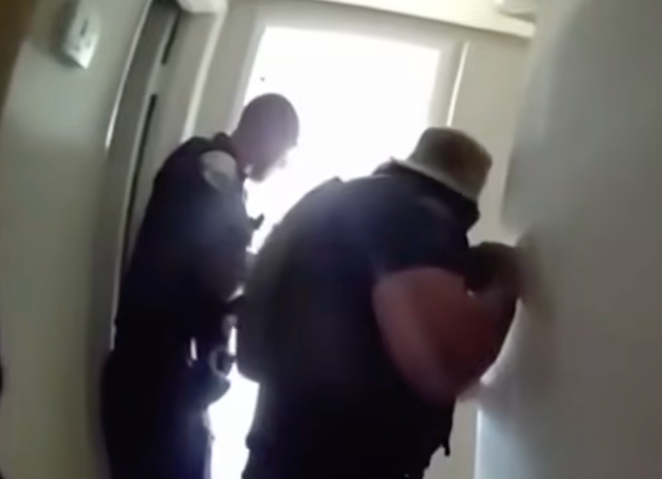 Body-camera footage recorded the moment that police found the four children hiding in the bathroom