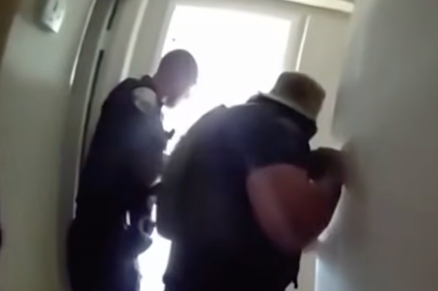 Body-camera footage recorded the moment that police found the four children hiding in the bathroom