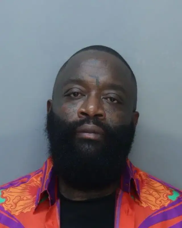 Rick Ross’ mug shot after being booked into jail on battery charges in Miami Beach