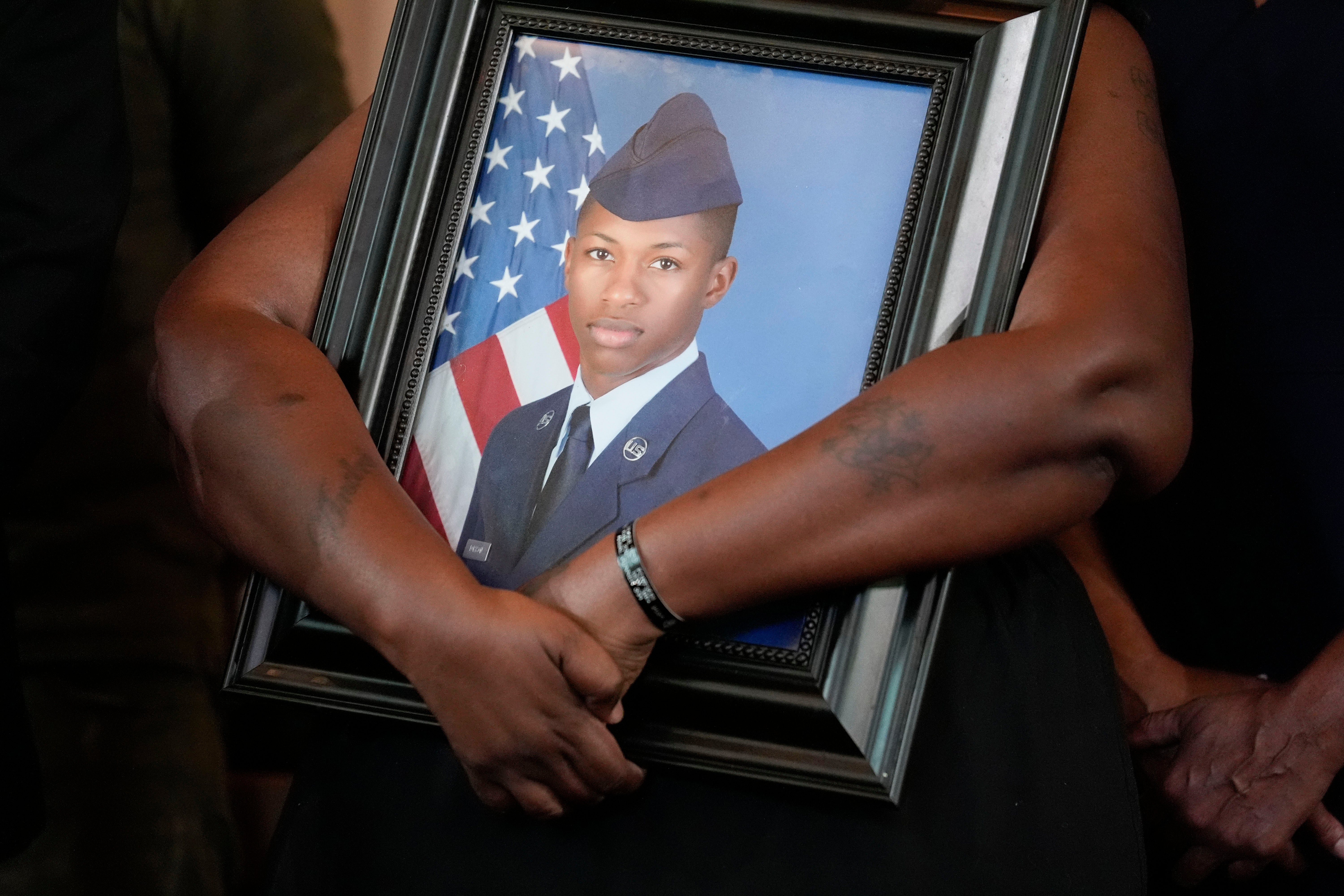 Chantemekki Fortson, mother of slain U.S. Air Force senior airman Roger Fortson, holds a photo of her son during a news conference with attorney Ben Crump on June 3, 2024, in Atlanta