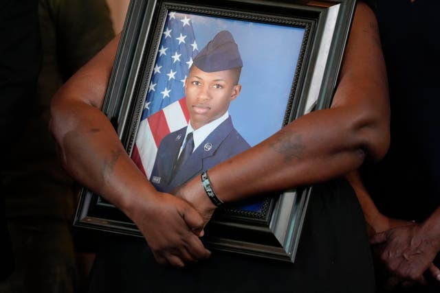 Chantemekki Fortson, mother of slain U.S. Air Force senior airman Roger Fortson, holds a photo of her son during a news conference with attorney Ben Crump on June 3, 2024, in Atlanta