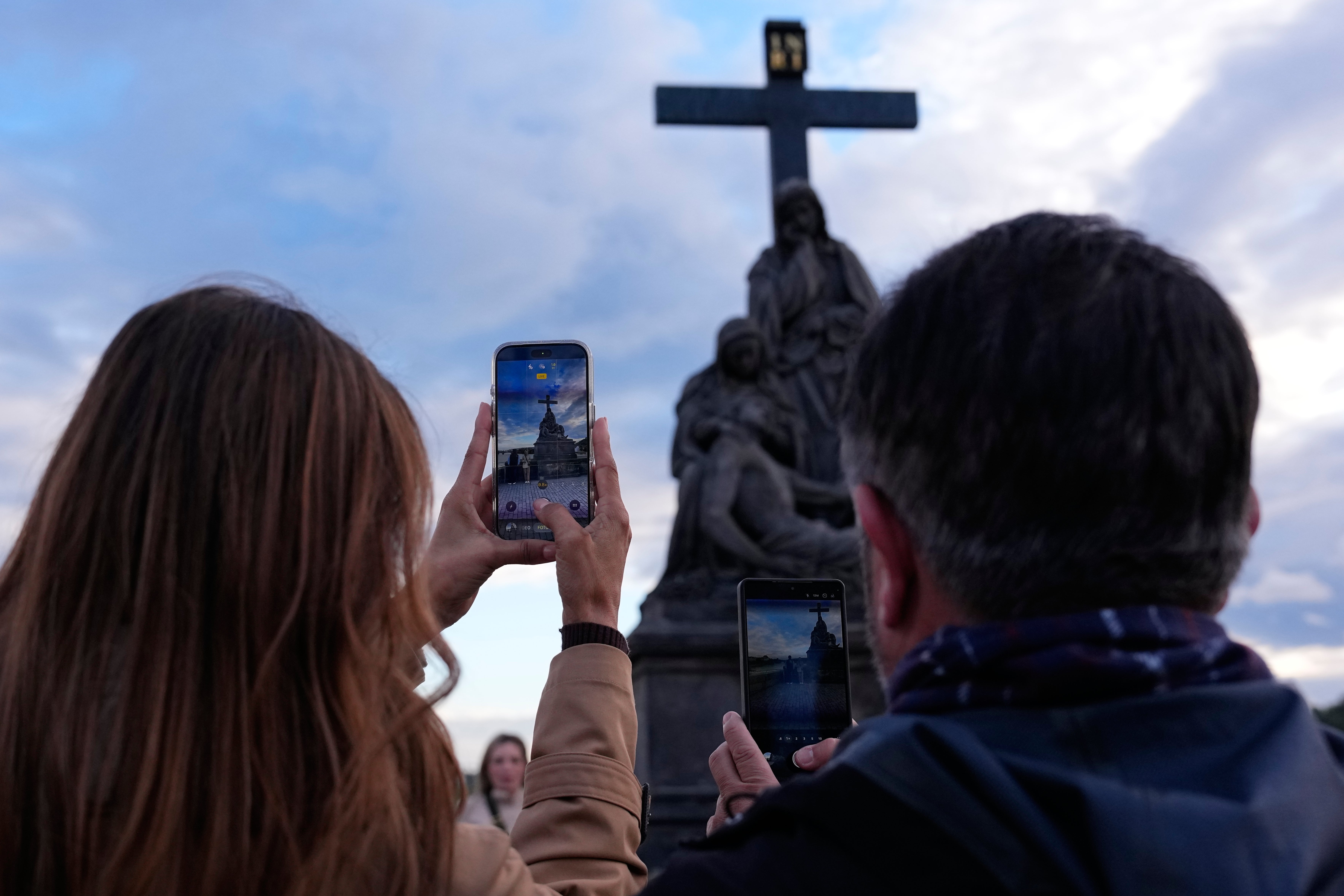 People pose to recreate a famous photo of two members of Depeche Mode, taken by Dutch photographer Anton Corbijn in 1988