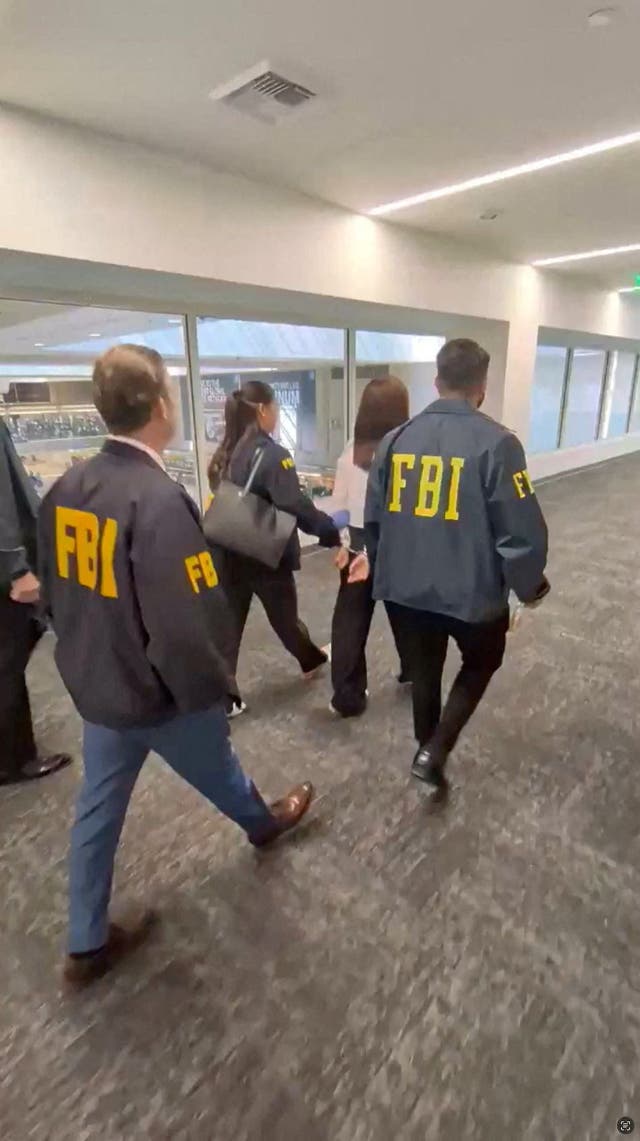 Zhang was detained just as she was about to board a flight to China, officials said