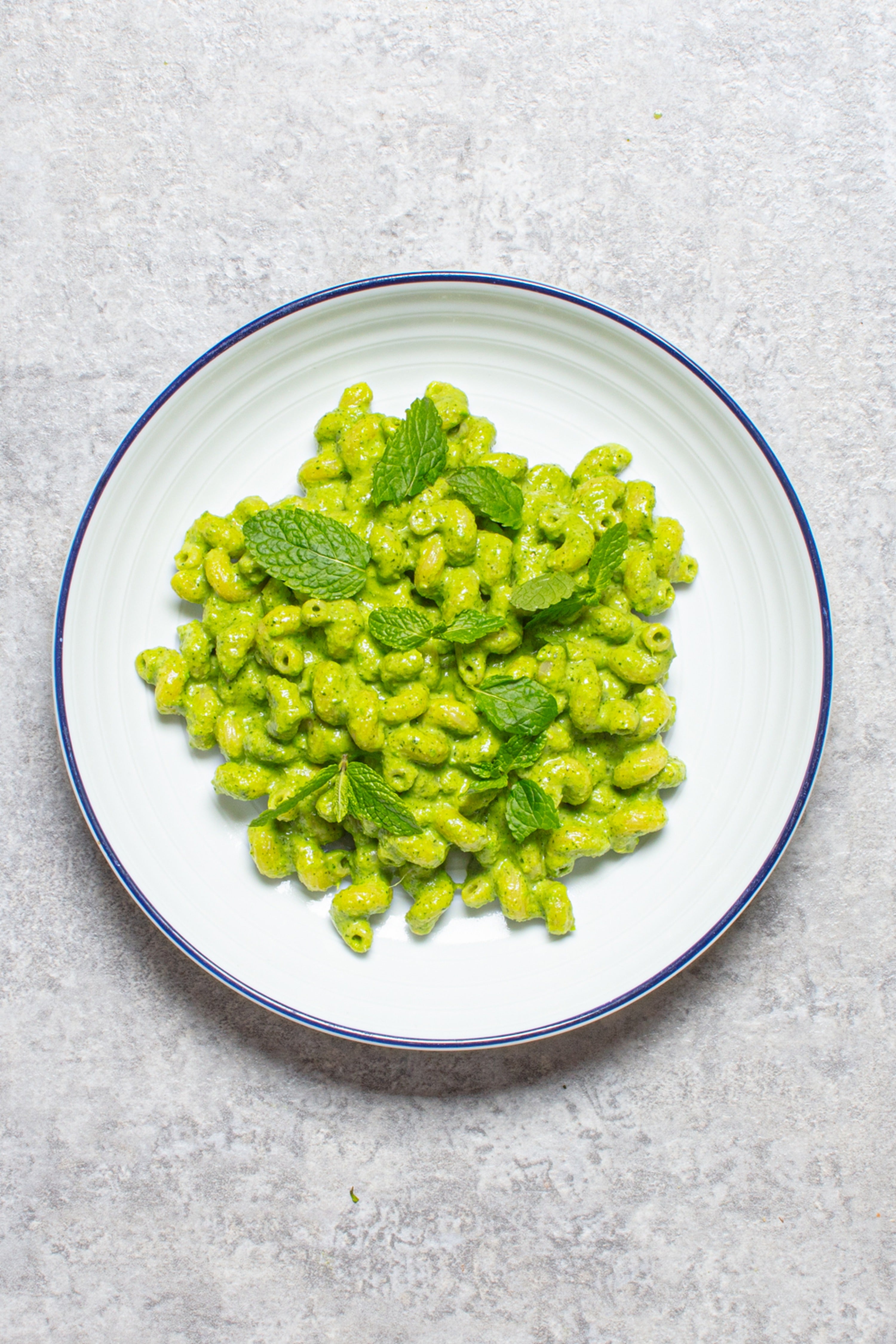 A bright, speedy pesto pasta made with peas, mint, basil and hazelnuts