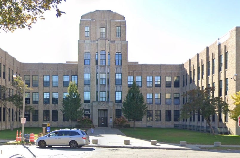 Students at Rufus King International High School told a school resource officer that Jones was 'using profane language, racial slurs, sexually derogatory statements and organizing students by race and gender in class,' according to a criminal complaint