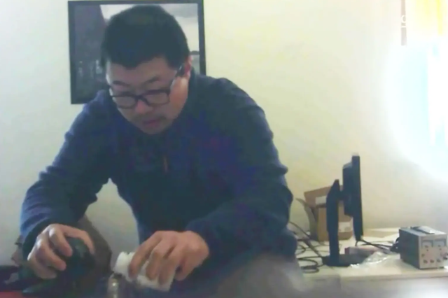 David Xu (pictured), who was filmed poisoning his colleague’s drinking water, is seeking to have charges against him dropped