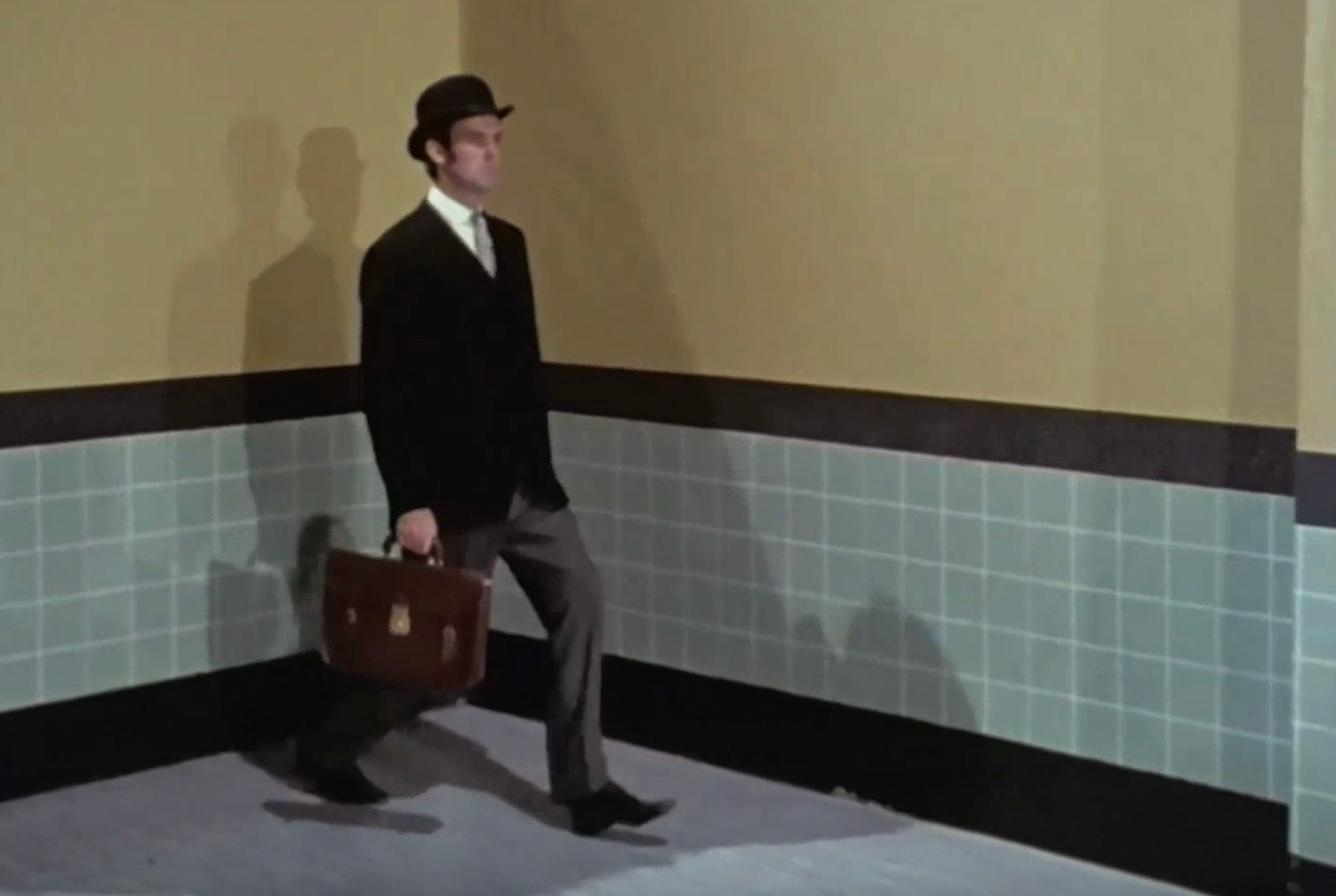 Actor John Cleese performs a silly walk in the legendary Monty Python sketch, Ministry of Silly Walks in 1970