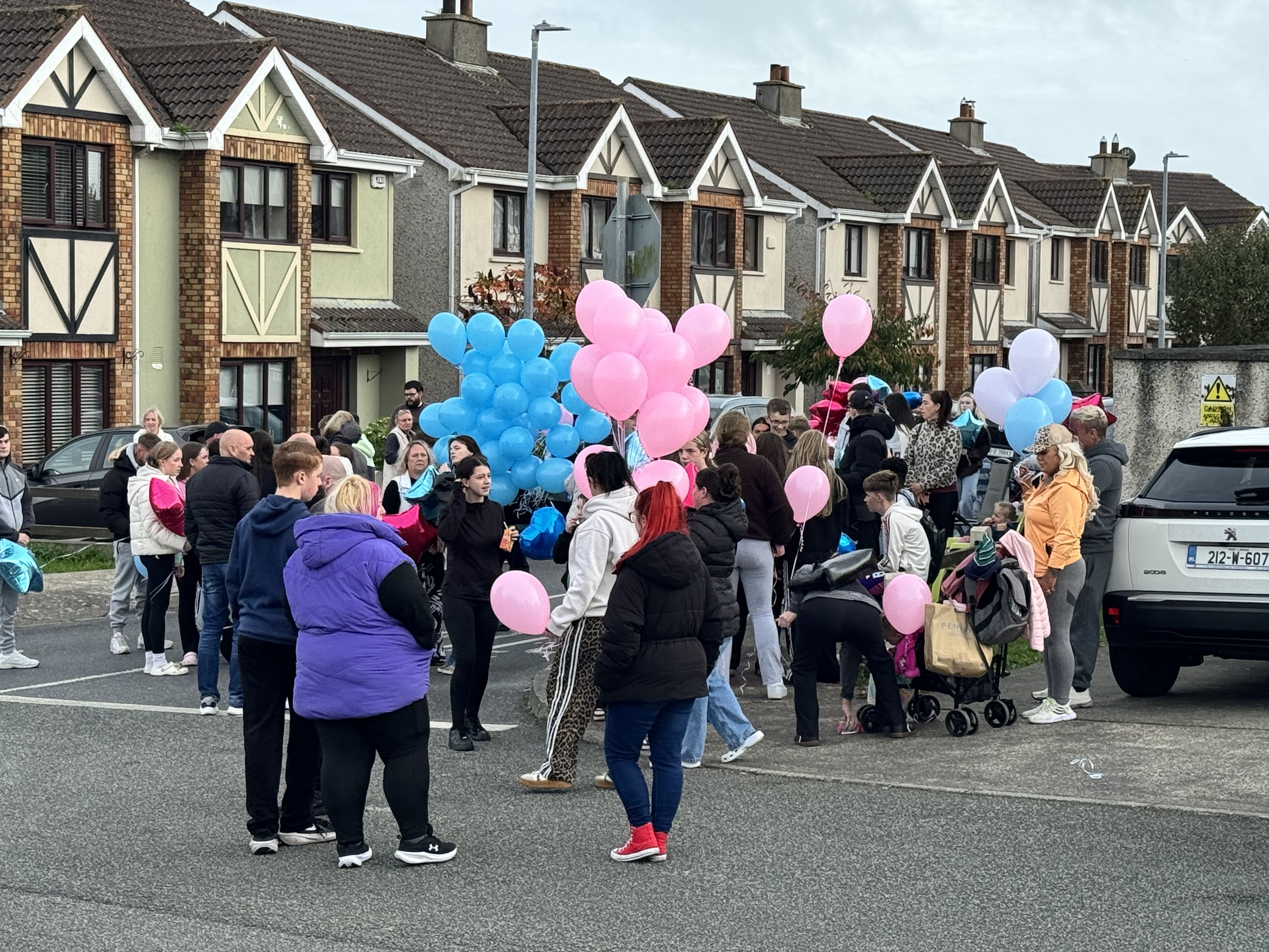 People gather ahead of a balloon release ceremony (Mícheál Ó Scannáil/PA)