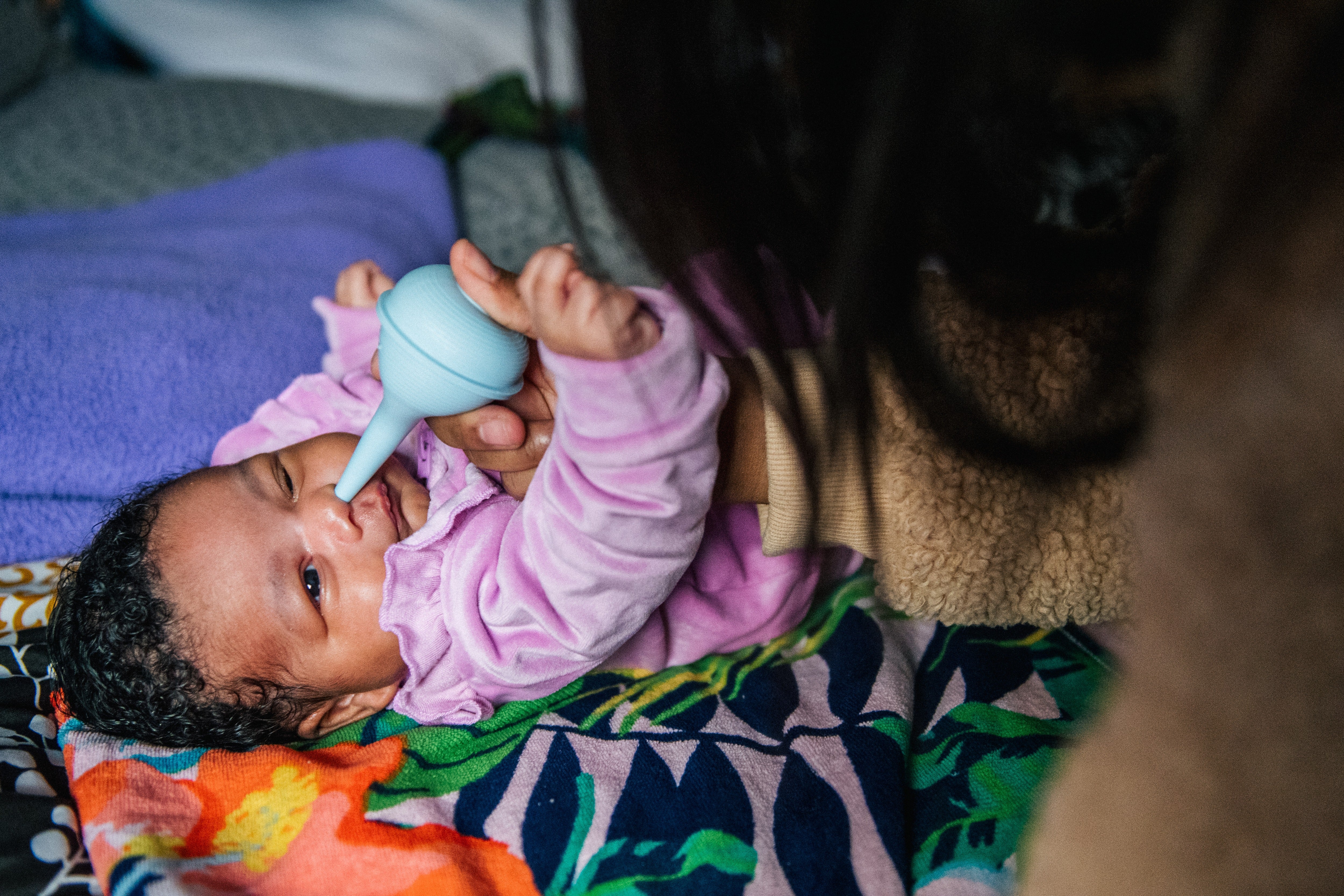 A nasal aspirator, a syringe-like device, can help remove mucus from a baby or child’s nose