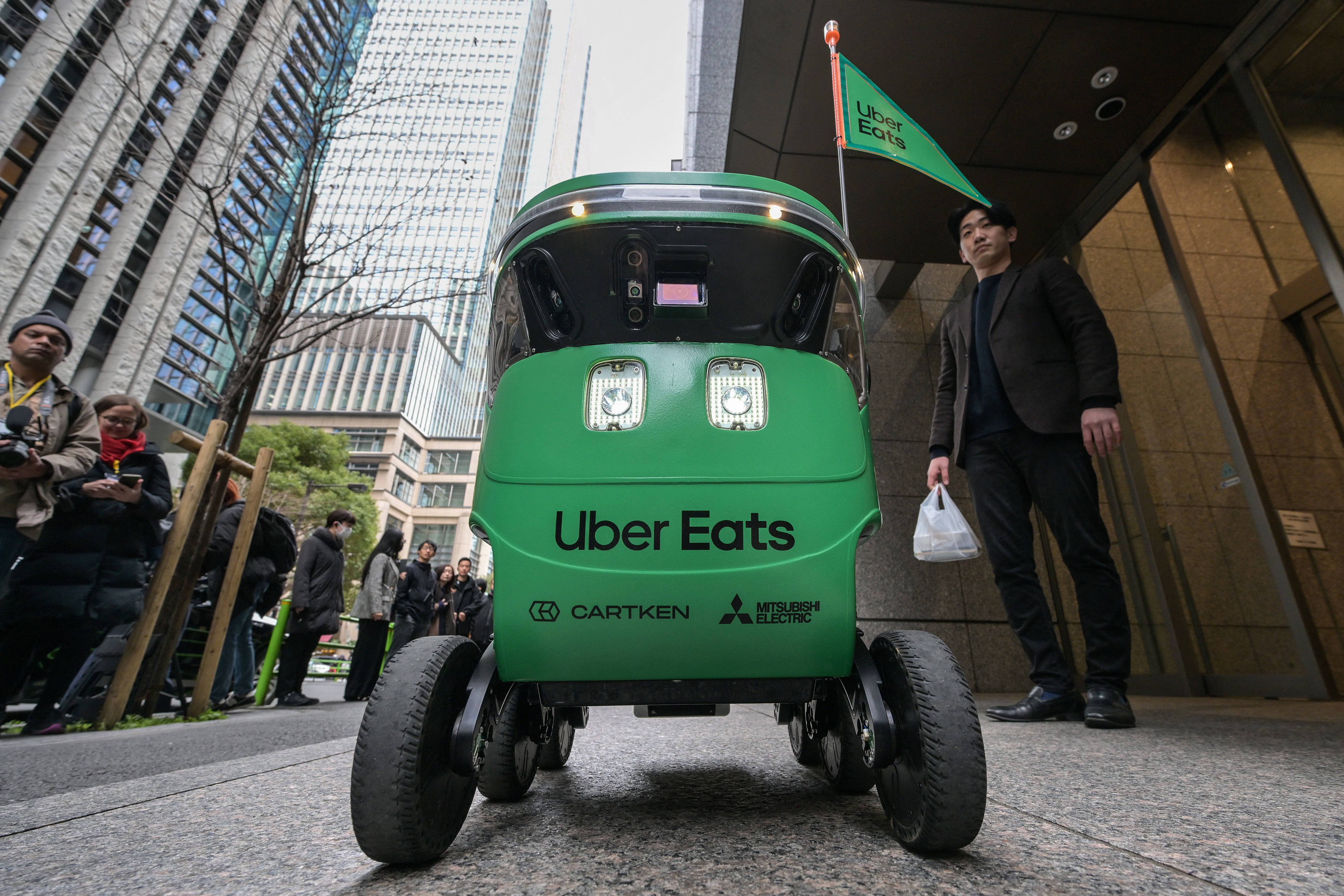 78-year-old former college professor arrested for blocking delivery robot in protest - The Independent