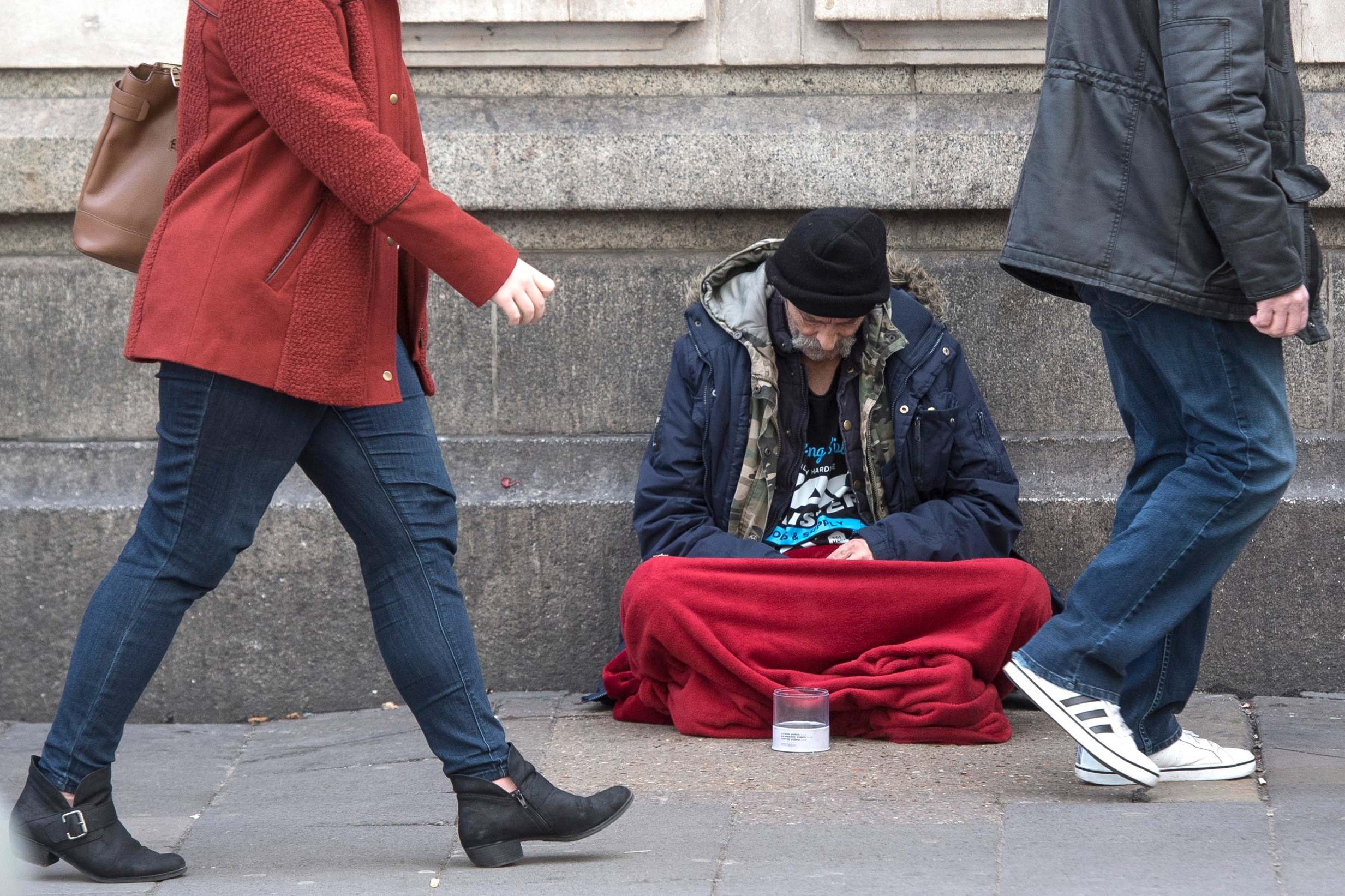 A homeless person outside Victoria Station in London (PA Wire/PA Images)