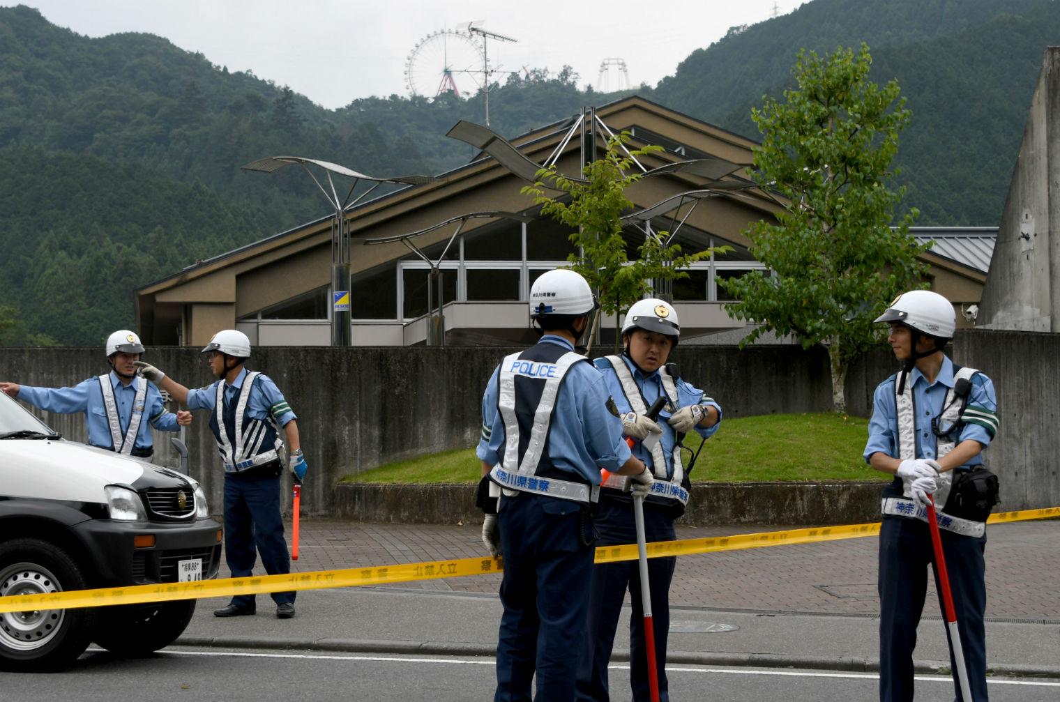 Police officers guard the care centre in Sagamihara after the stabbings (Picture: Toshifumi Kitamura/AFP/Getty Images)