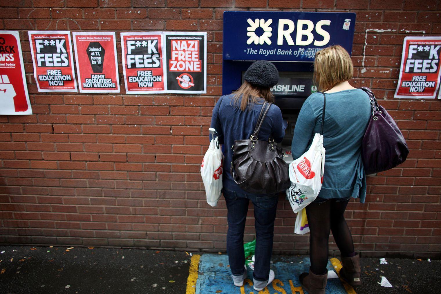 Students arriving for Manchester University's freshers week queue up at a cash machine