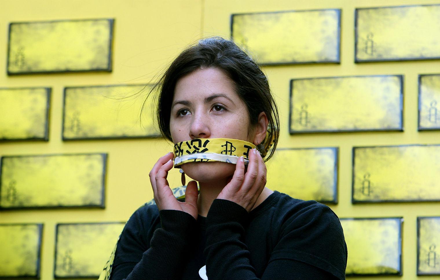 A member of Amnesty International protesting against censorship in 2008