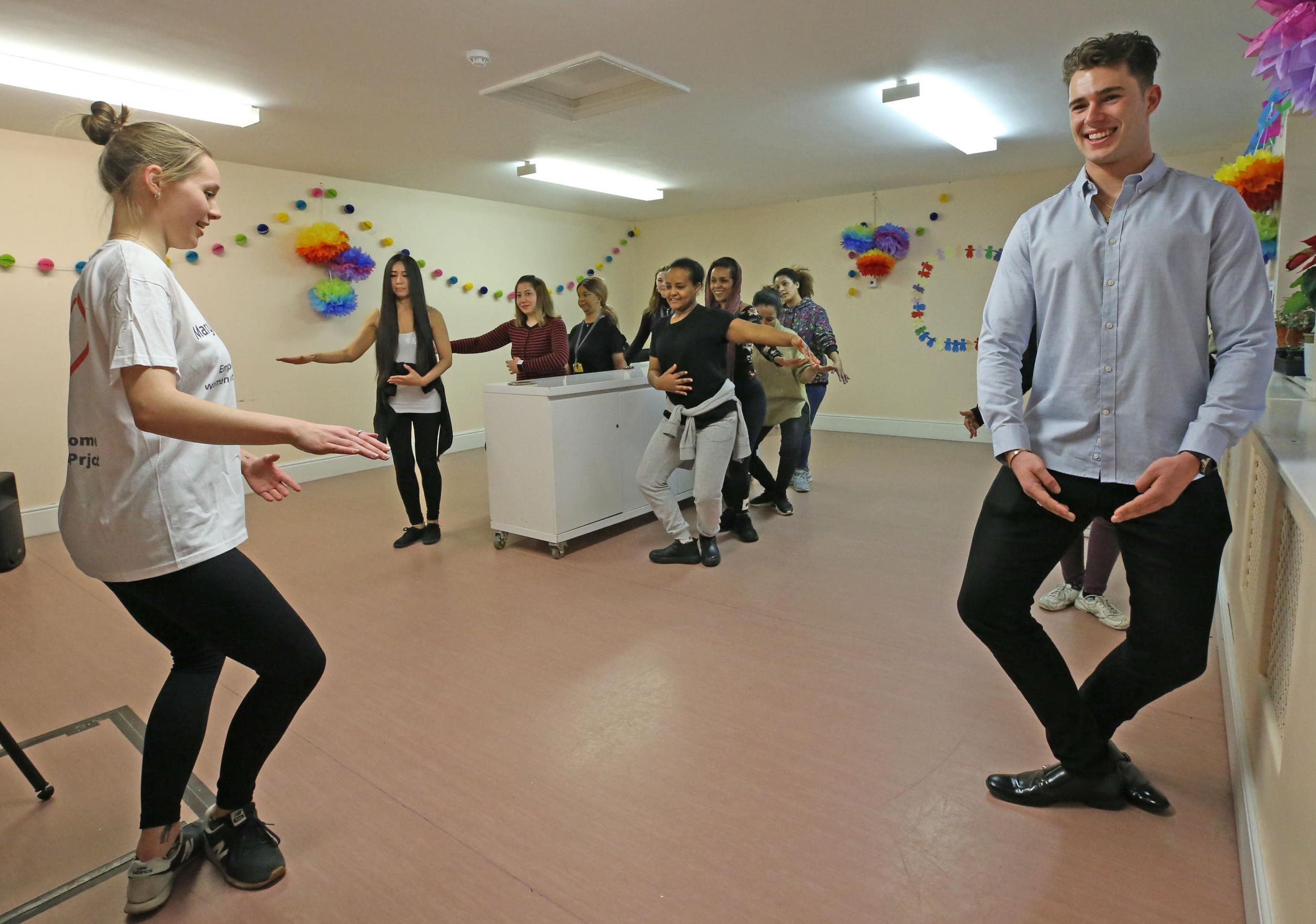 Curtis warms up with some gentle ballet, led by Derby University student Katie Baxter-Brown (Nigel Howard)