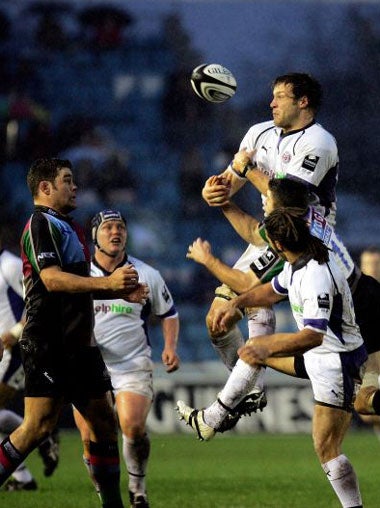 Bath's Andy Beattie loses the ball at a soaked Stoop