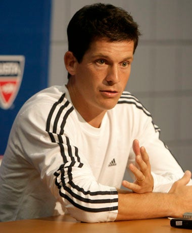 Henman calls time on a 13-year career at a press conference in New York yesterday