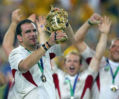 Martin Johnson holds aloft the Webb Ellis Cup