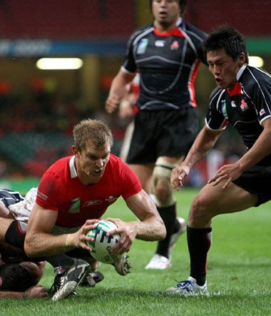 Dafydd James dives over to score for Wales