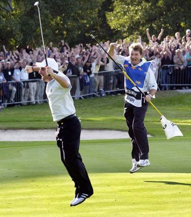 Paul McGinley (left) celebrates sinking the putt that sealed Europe's Ryder Cup win in 2002