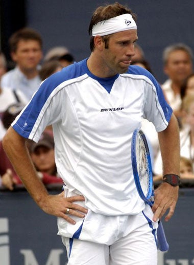 Rusedski's body language says it all during his 7-6, 6-2, 6-3 defeat by Tim Henman in the first round