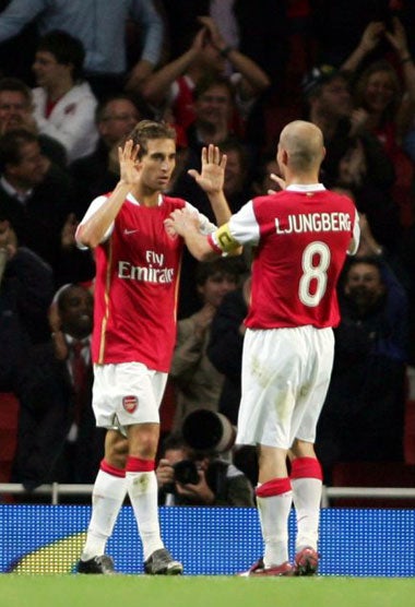 Goal-scorers Flamini and Ljungberg celebrate